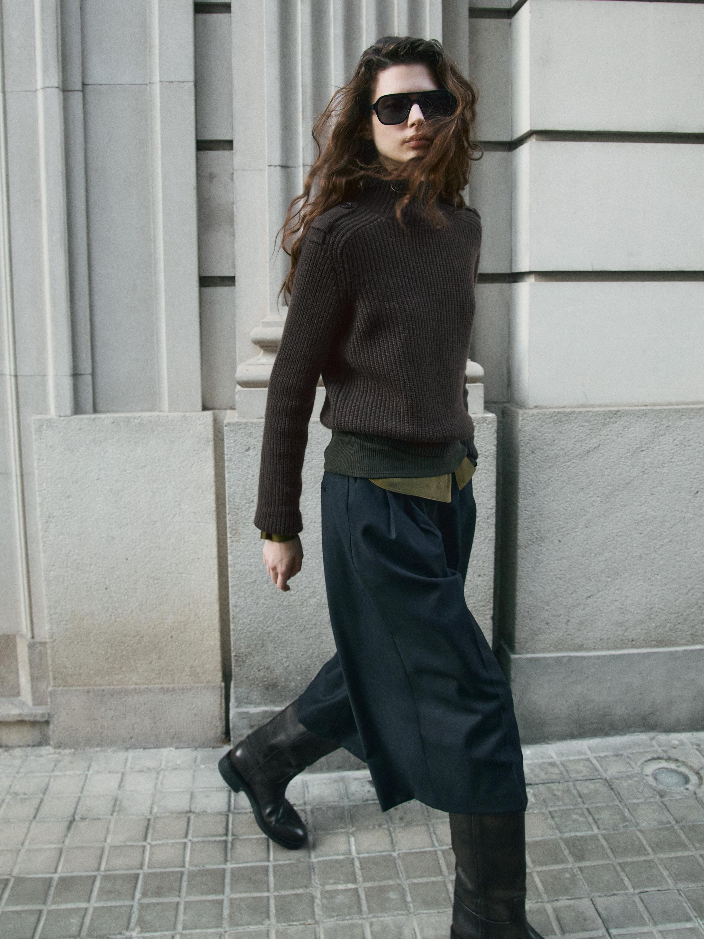 Knit sweater with shoulder detail