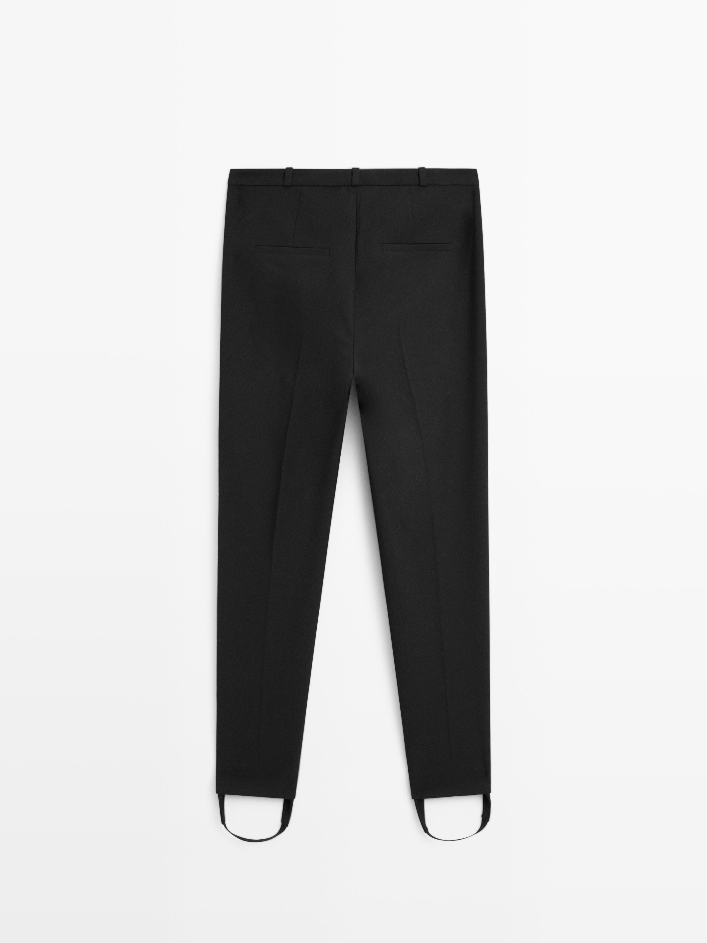 Pantaloni con pince e dettagli elasticizzati sull'orlo