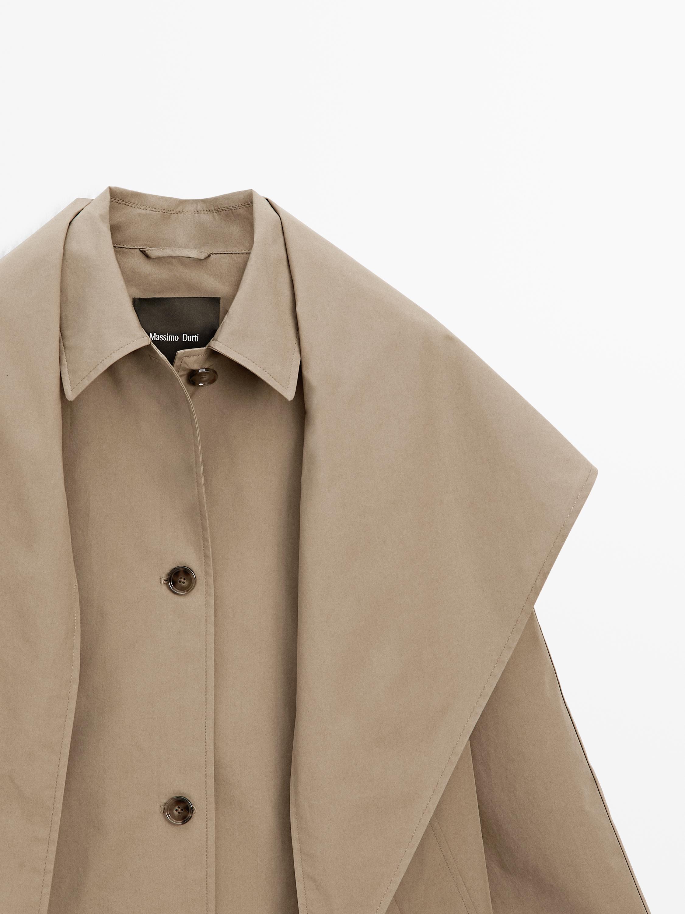 Trench coat with detachable scarf detail
