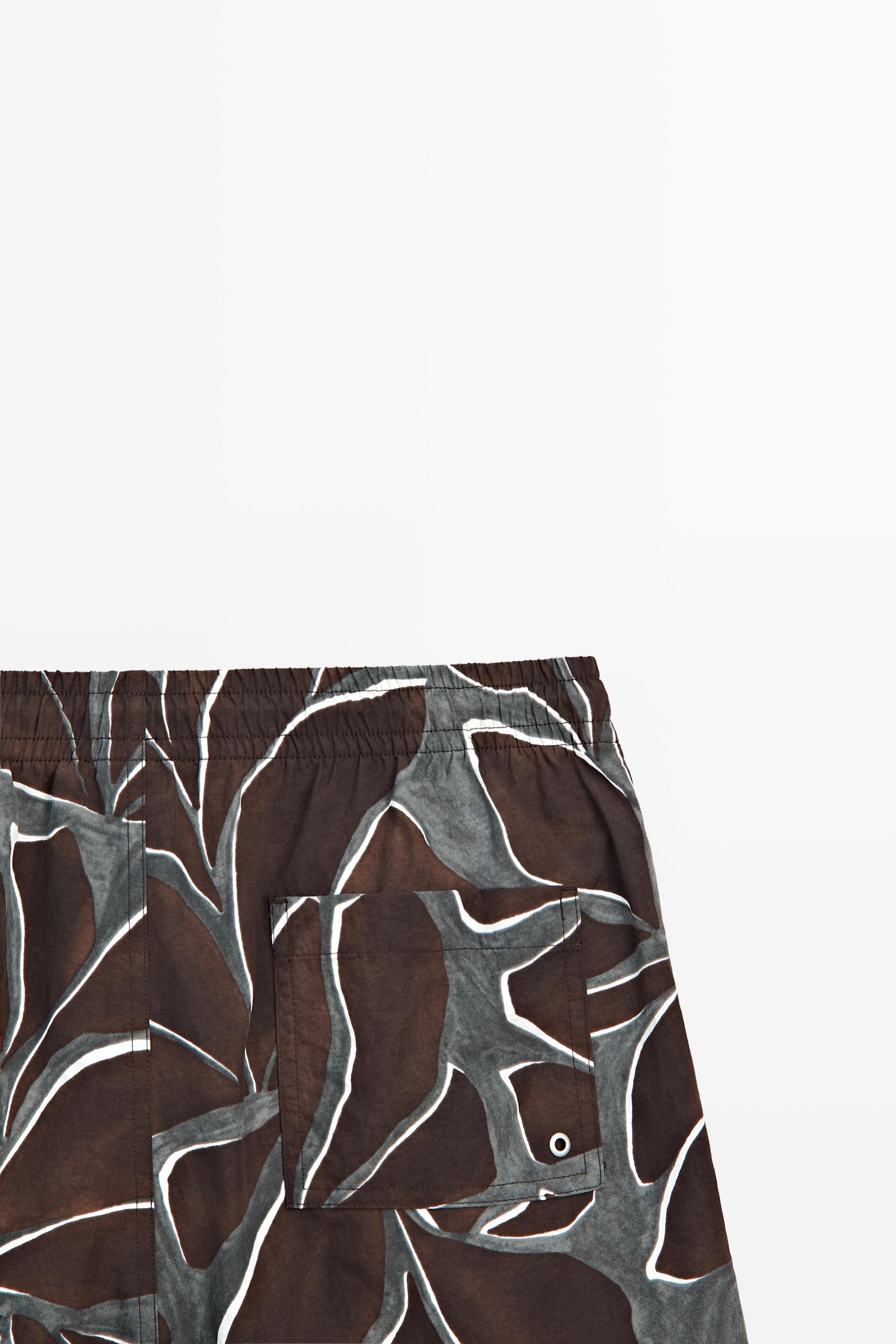 Tropical print swimming trunks — Chocolate