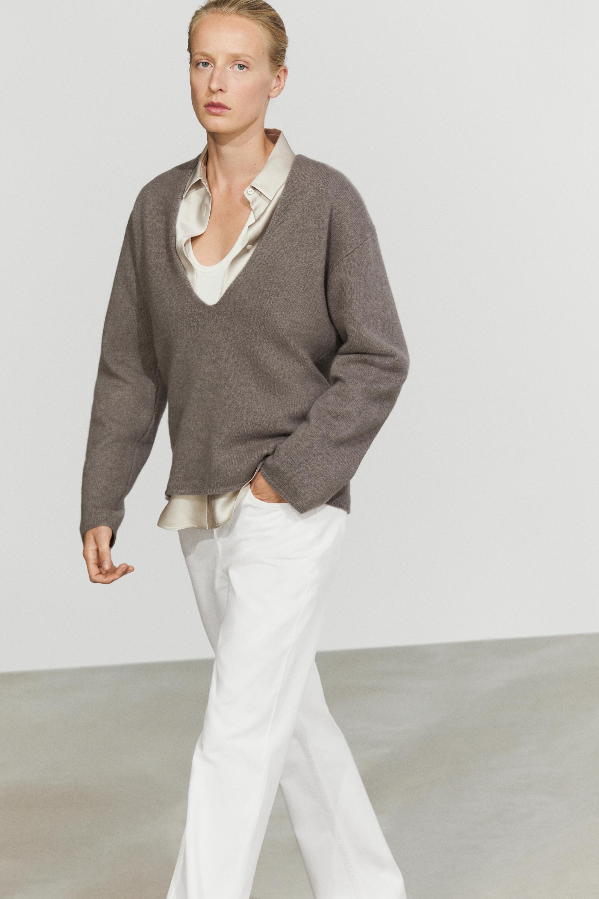 Long-line knit sweater with neckline detail