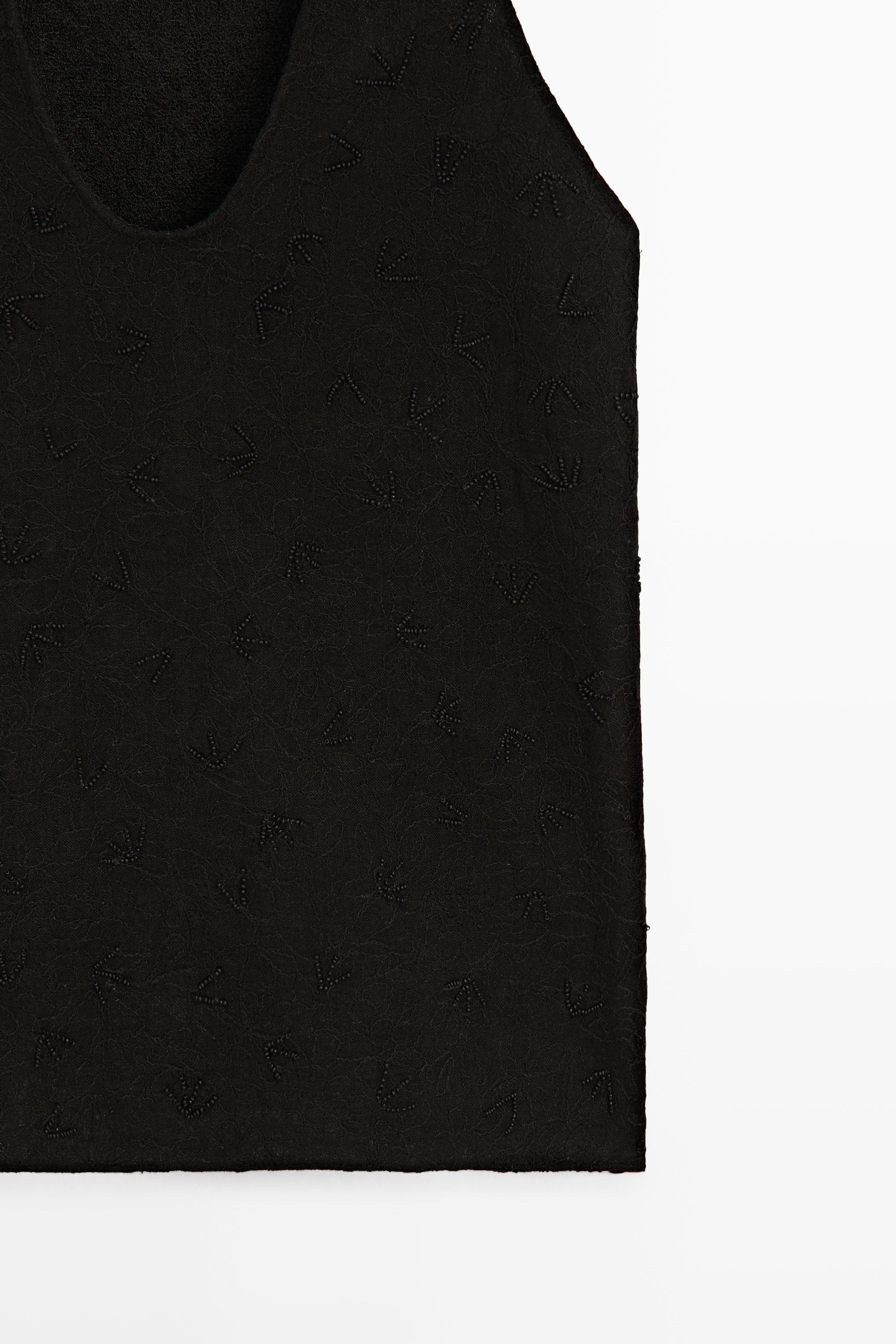 Flowing top with embroidery — BLACK