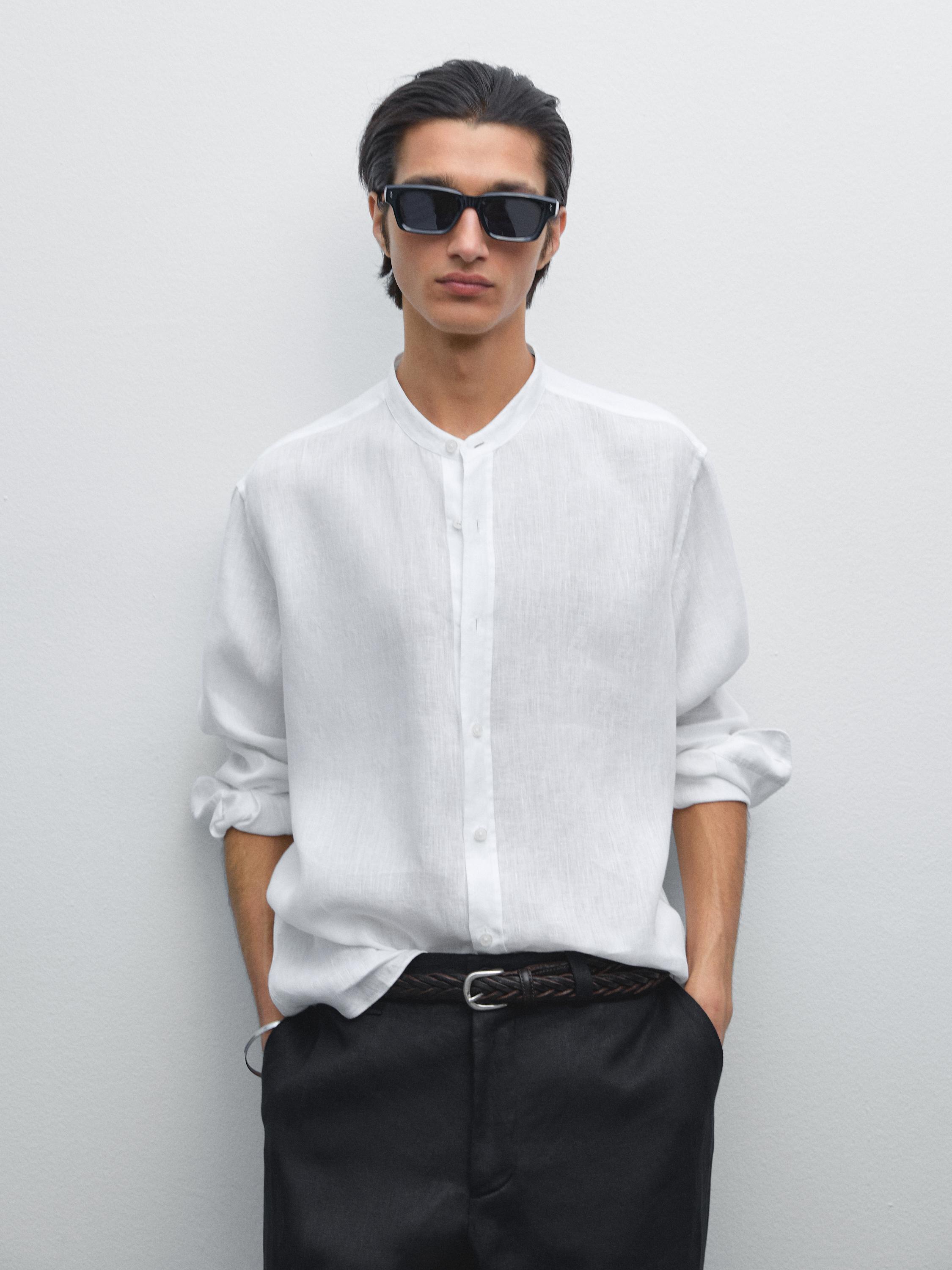 Medium shot of a white shirt with a mandarin collar and front buttons.
