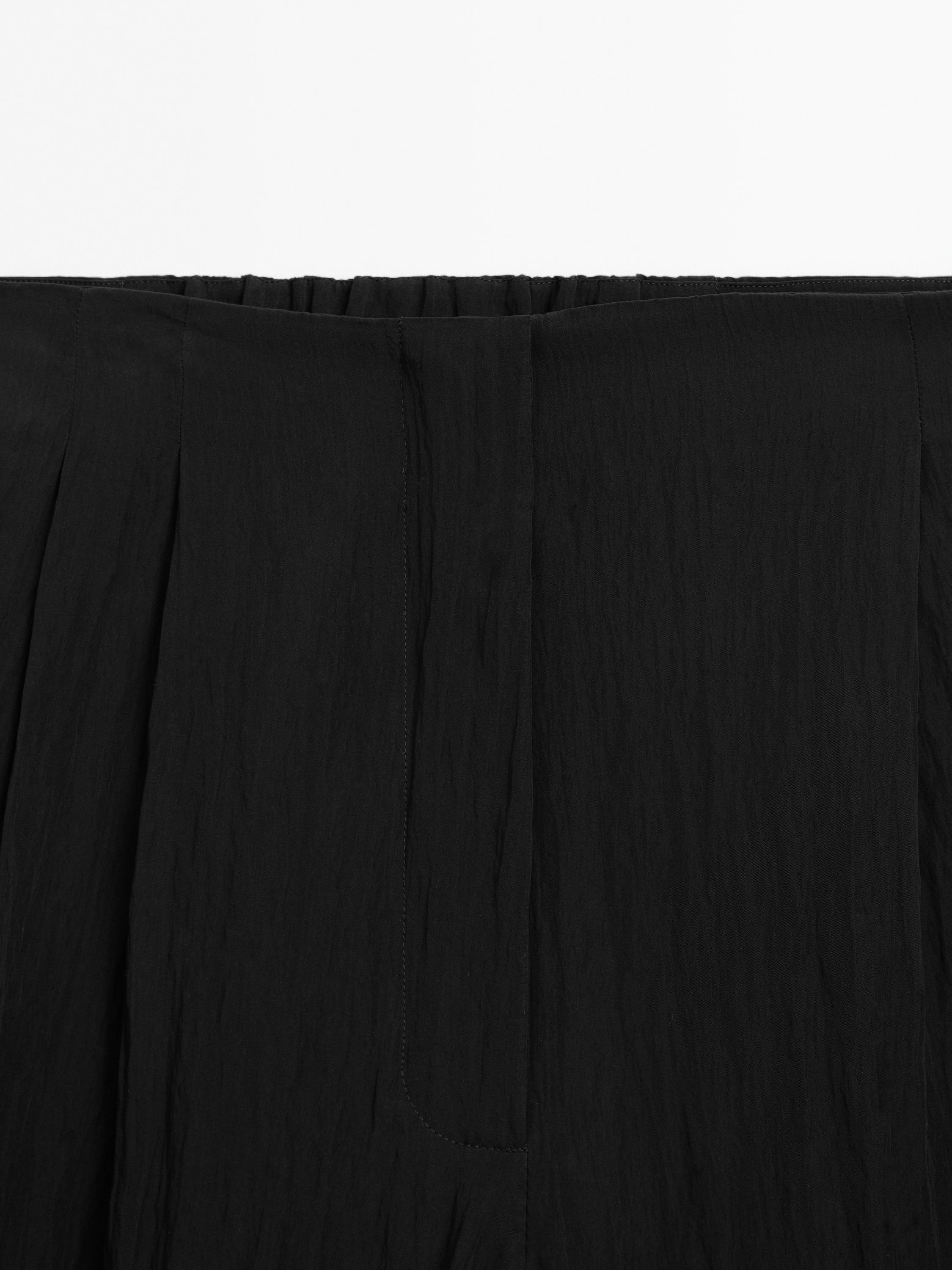 Spodnie z tkaniny technicznej z zakładkami