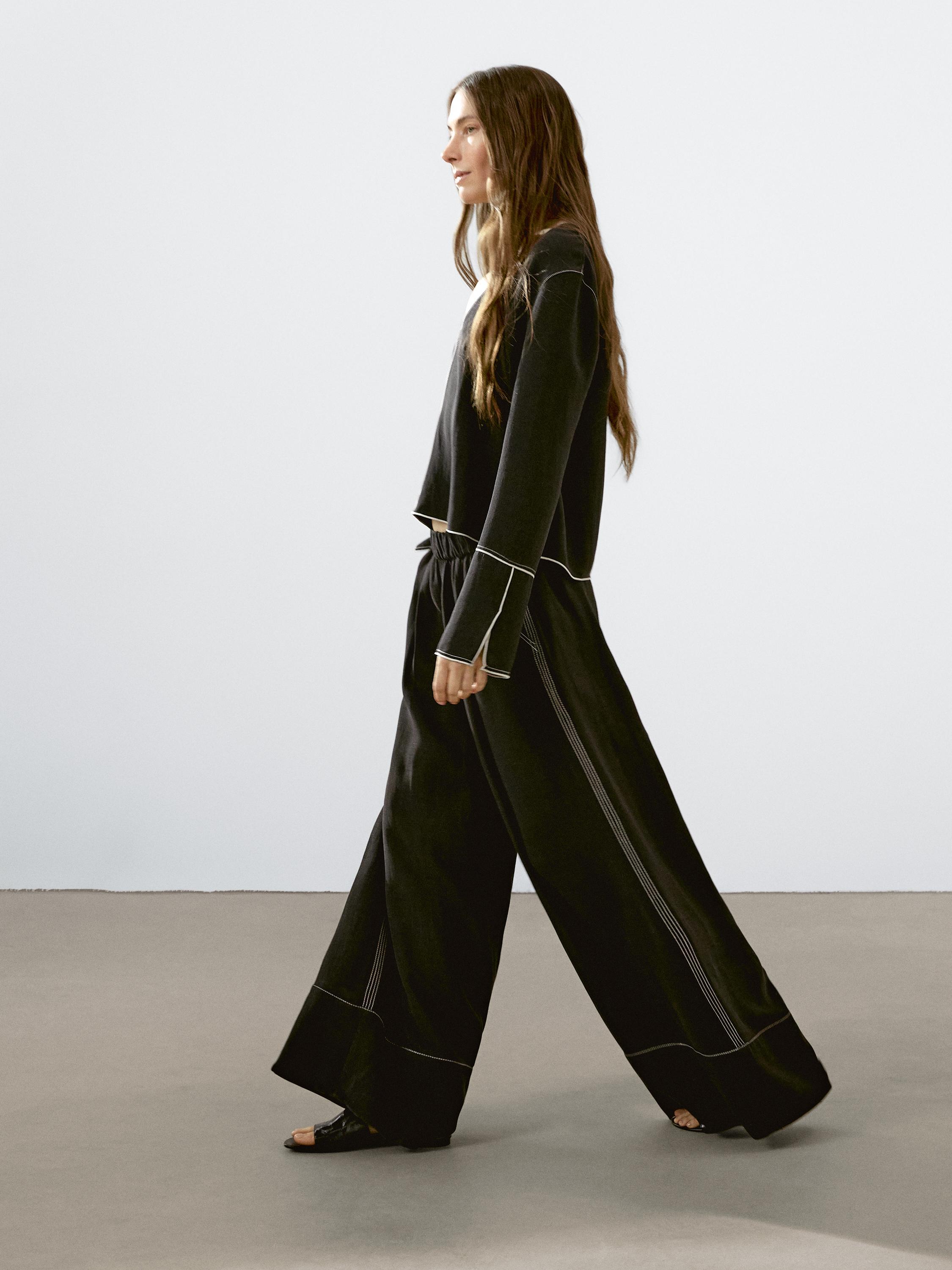 Flowing trousers with contrast topstitching