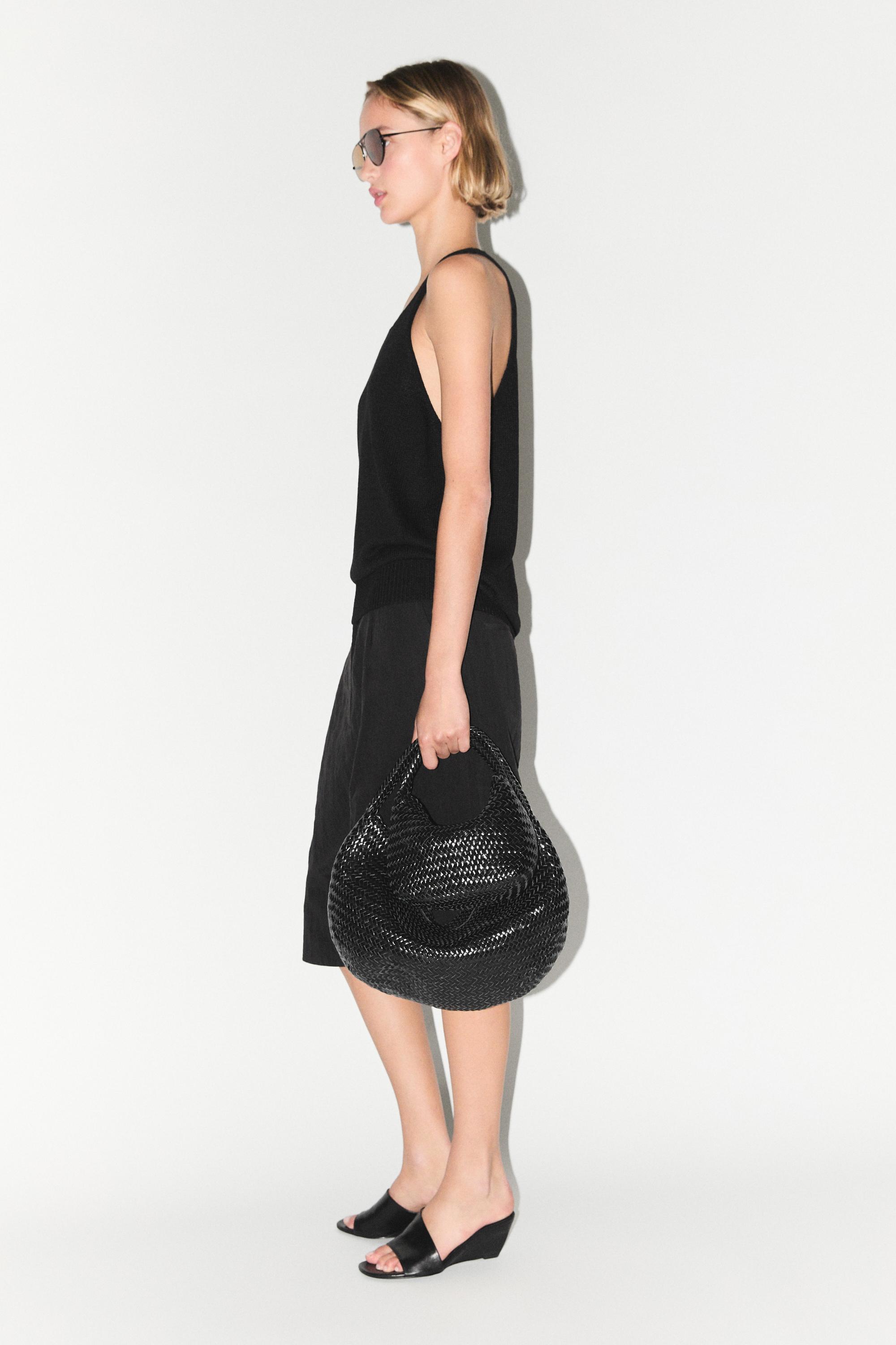 Braided leather half-moon bag — BLACK