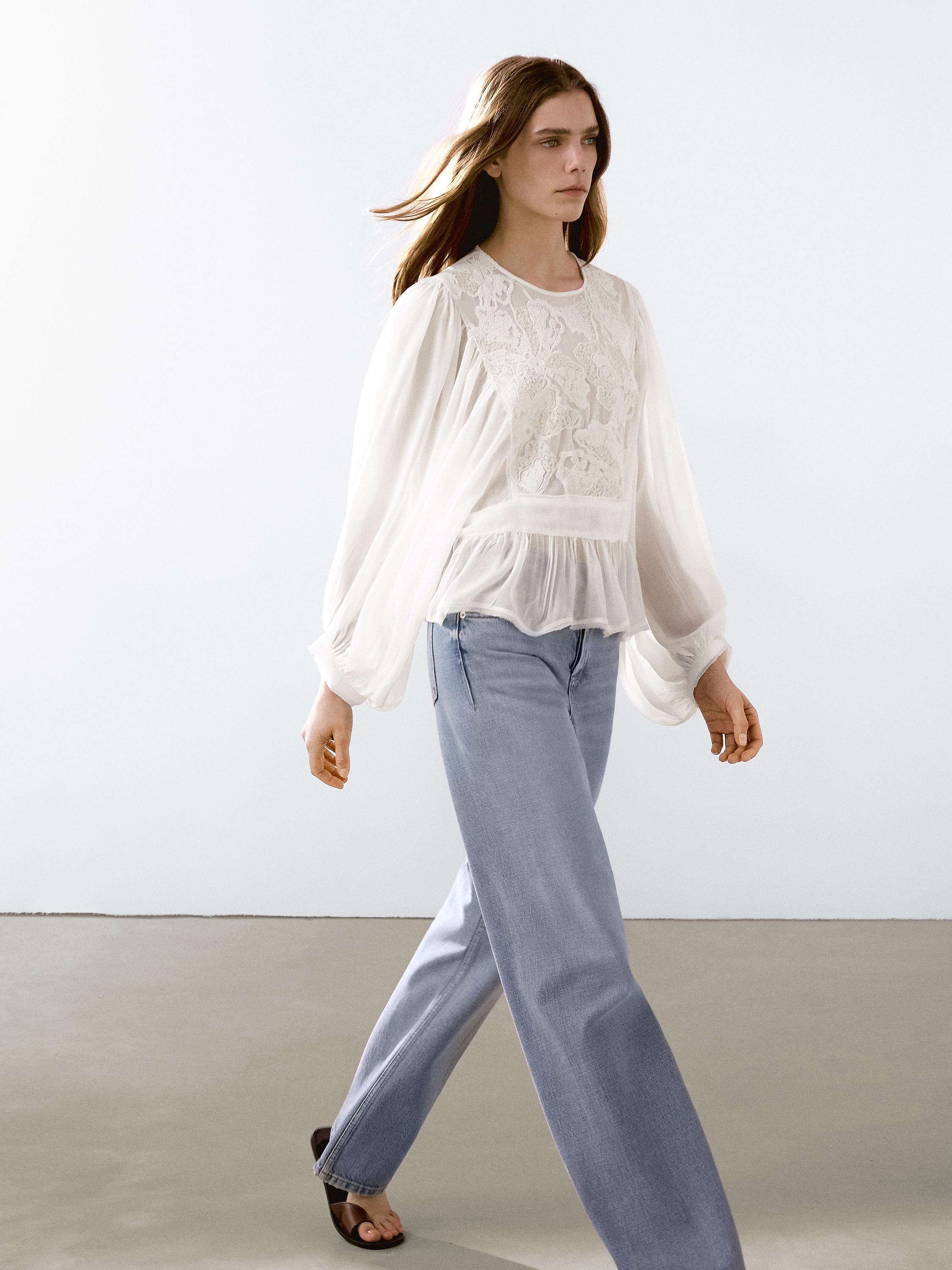 Flowing embroidered peplum blouse
