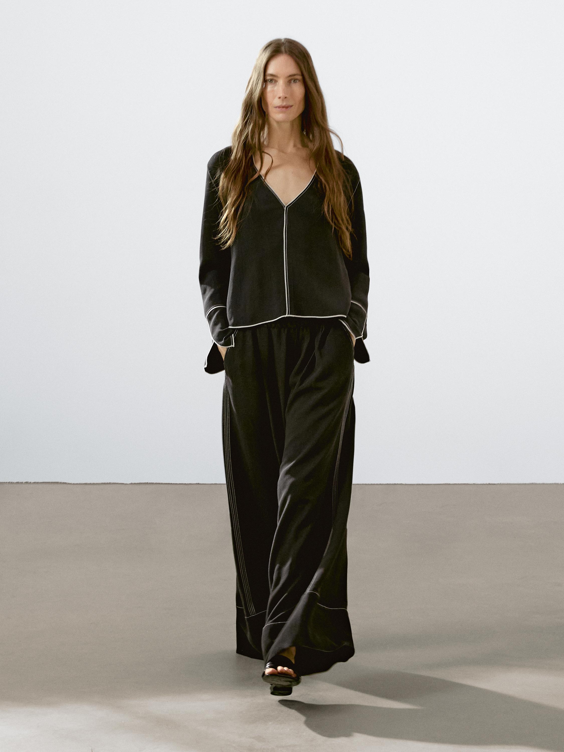 Flowing trousers with contrast topstitching