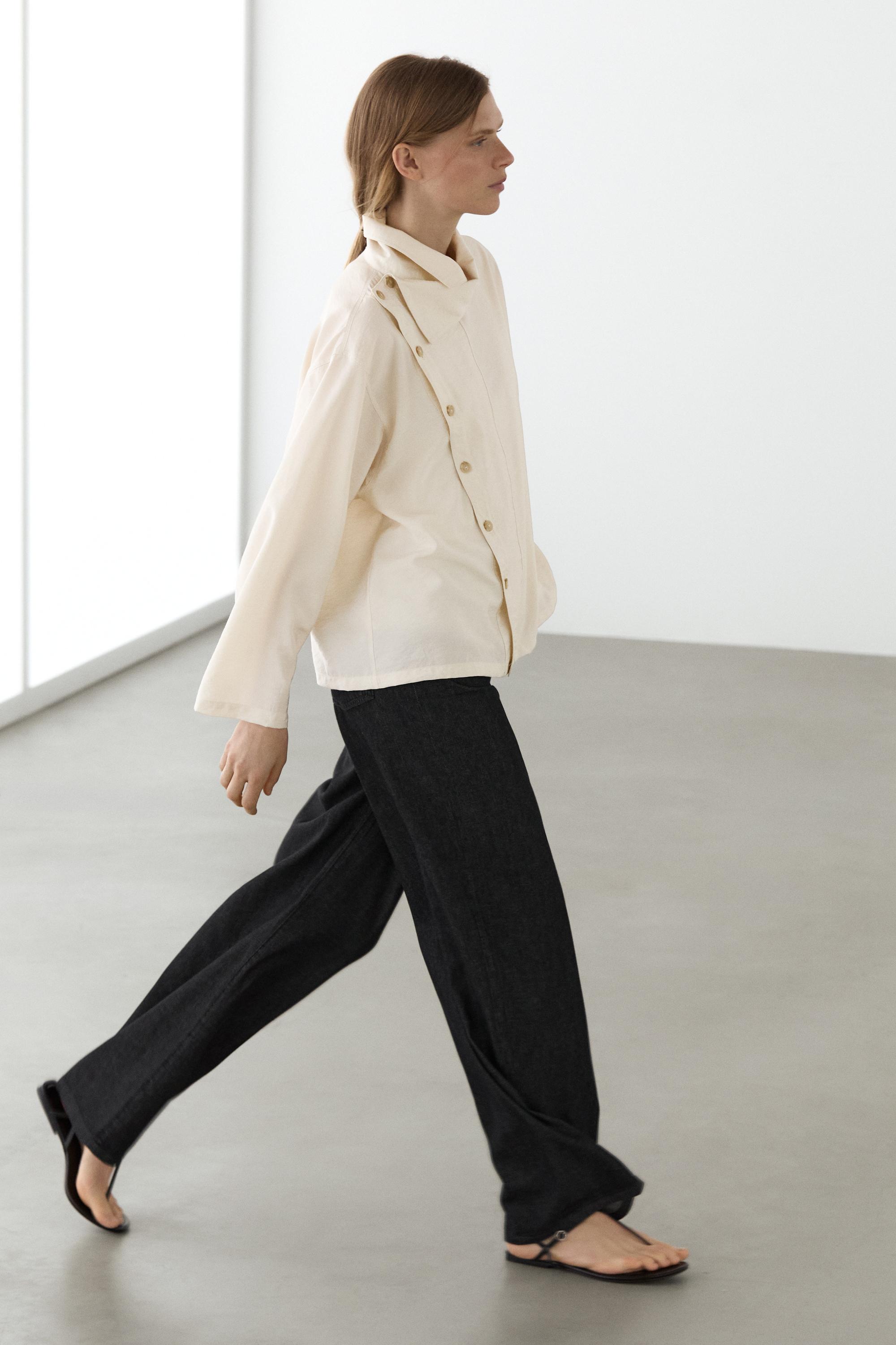 Flowing shirt with asymmetric buttons