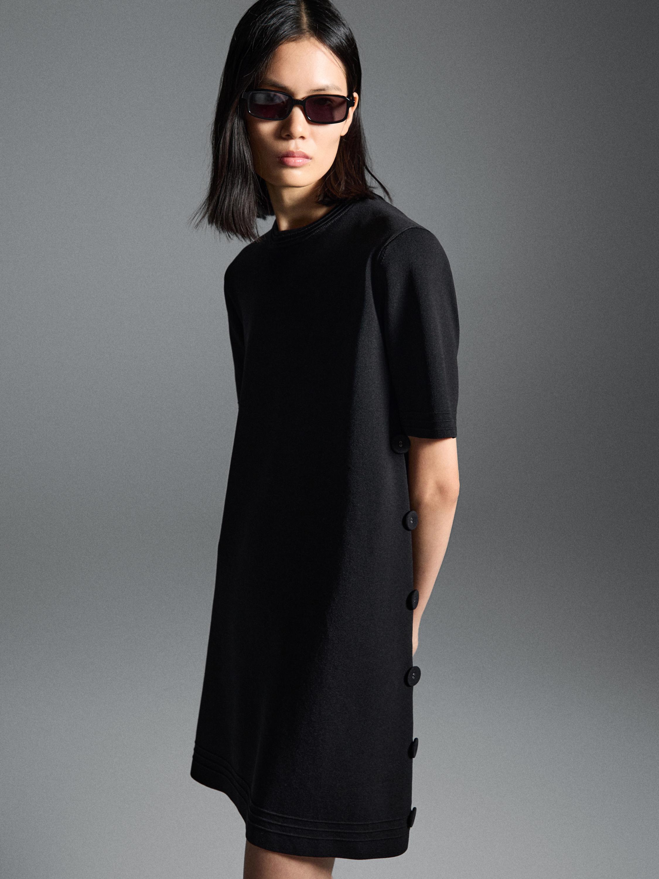 Short knit dress with side button details