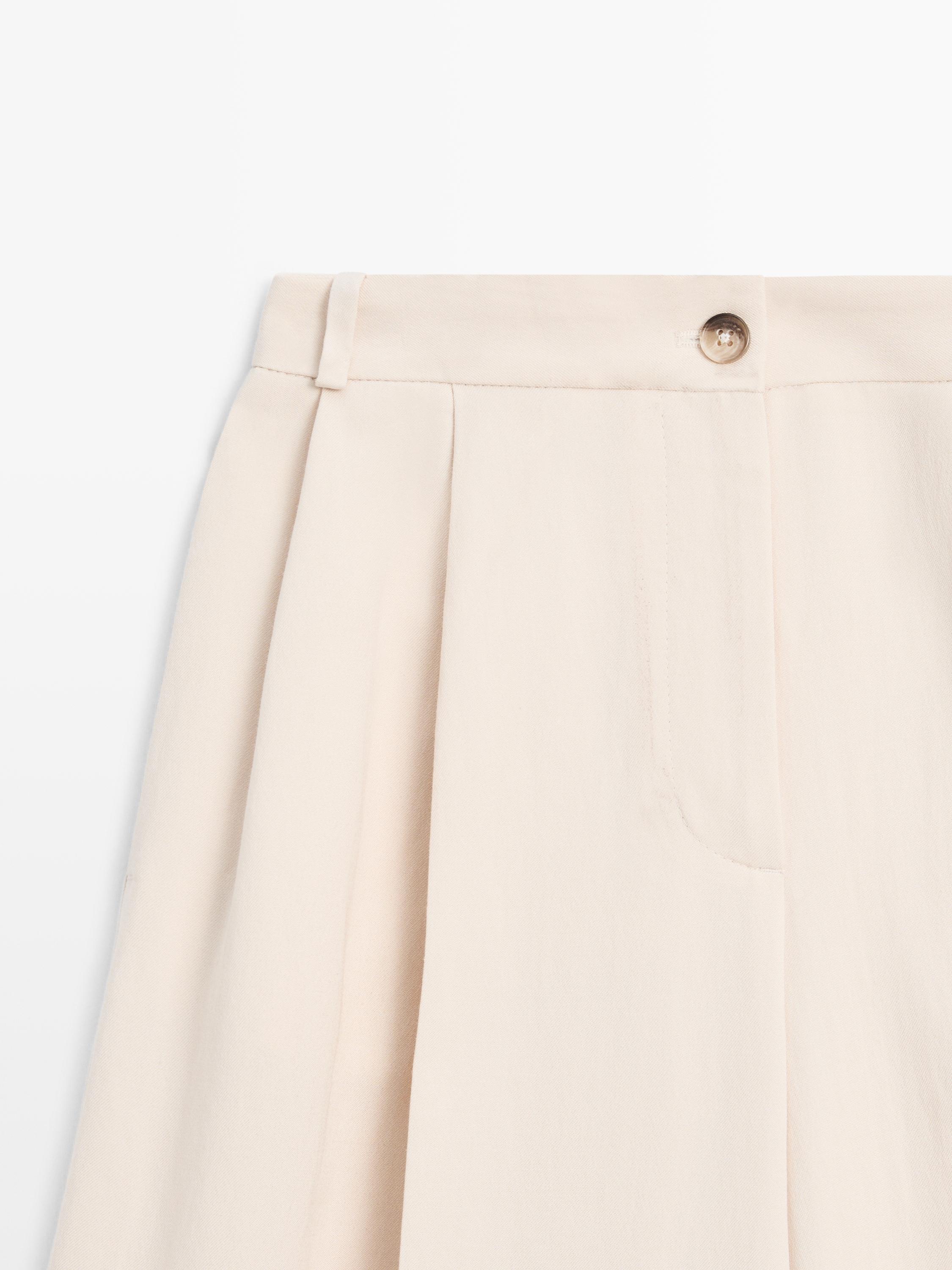 Flowing trousers with turn-up hems — CREAM