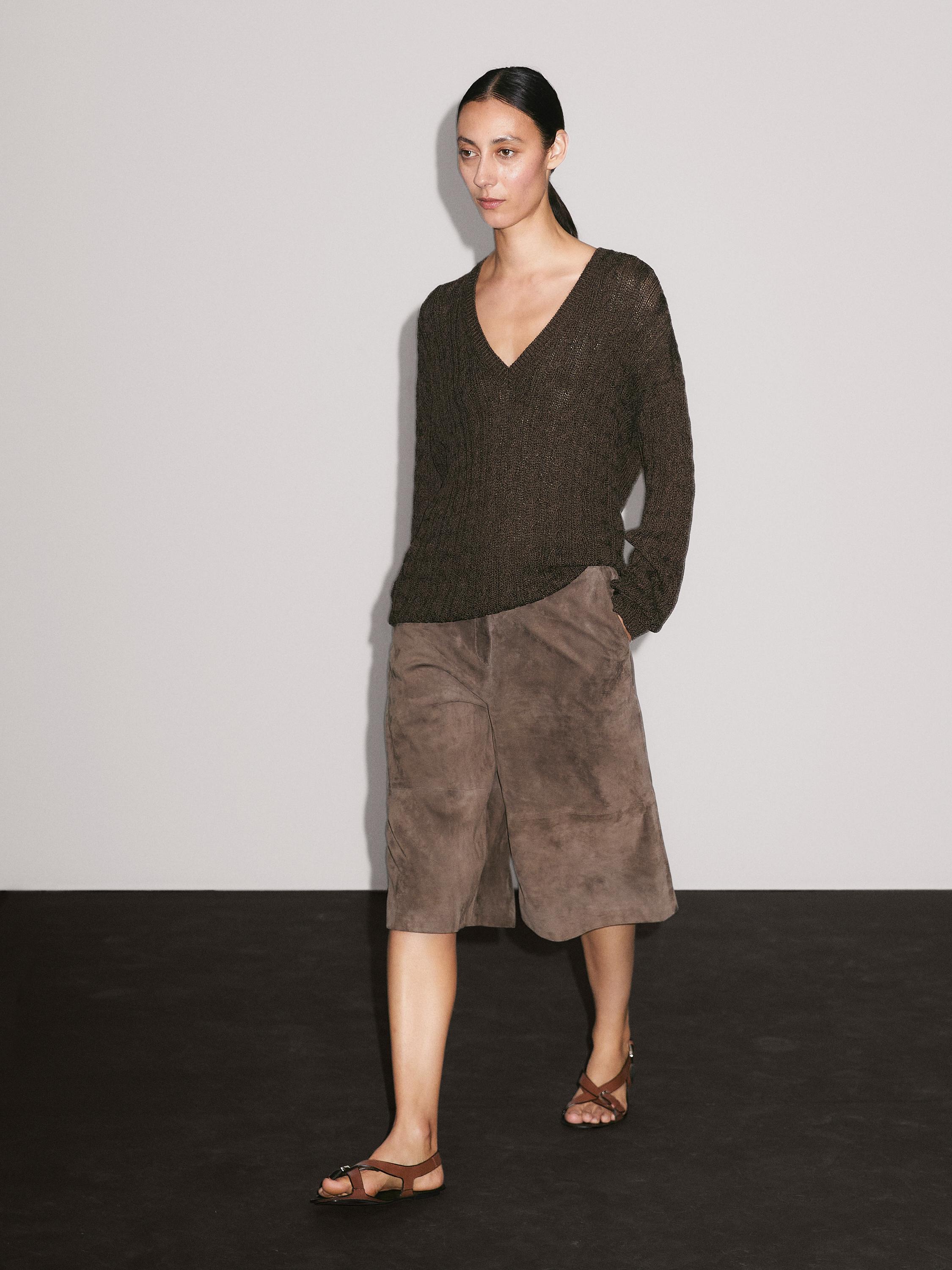 Maglia a trecce con scollo a v