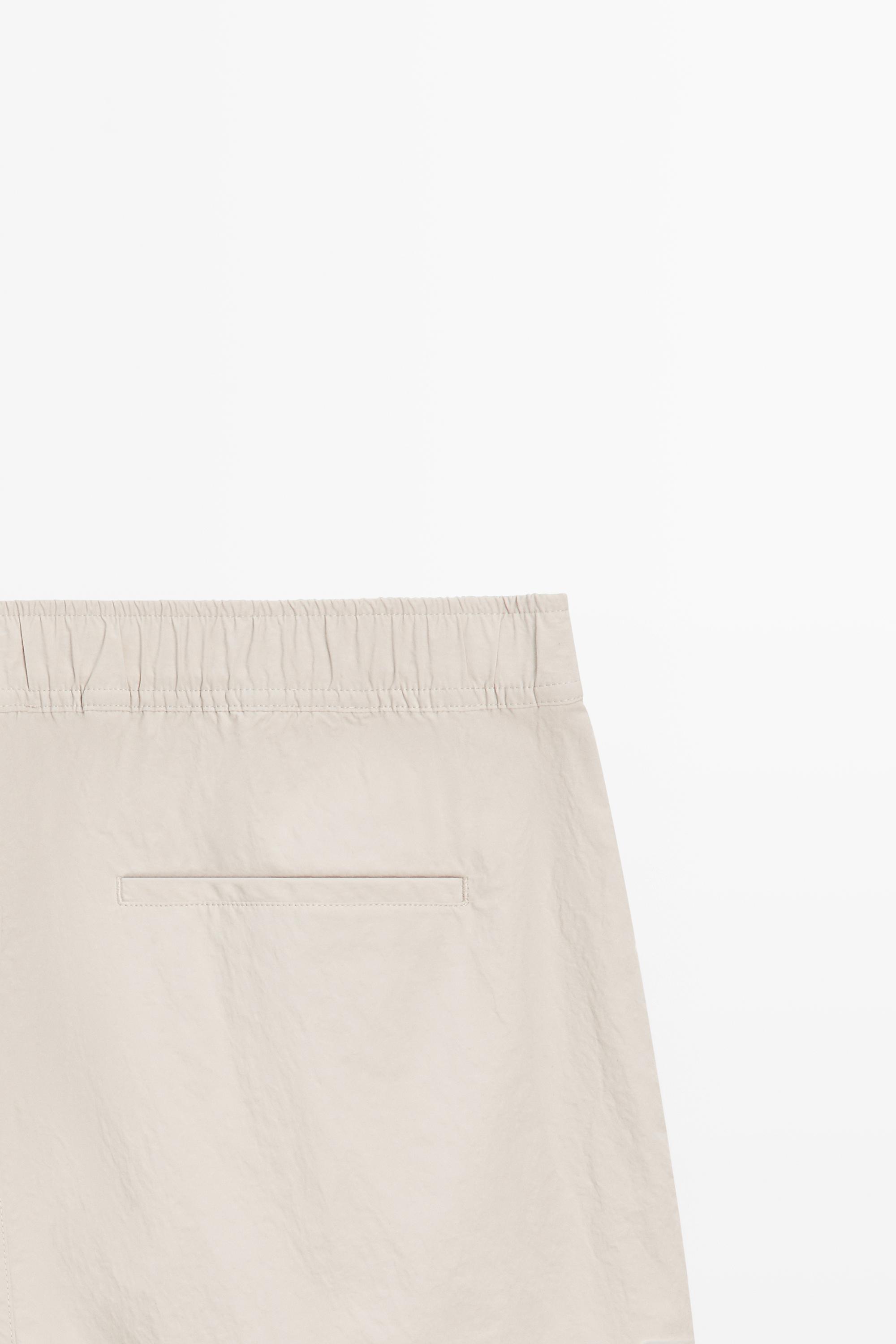Plain swimming trunks with waist detail — SAND