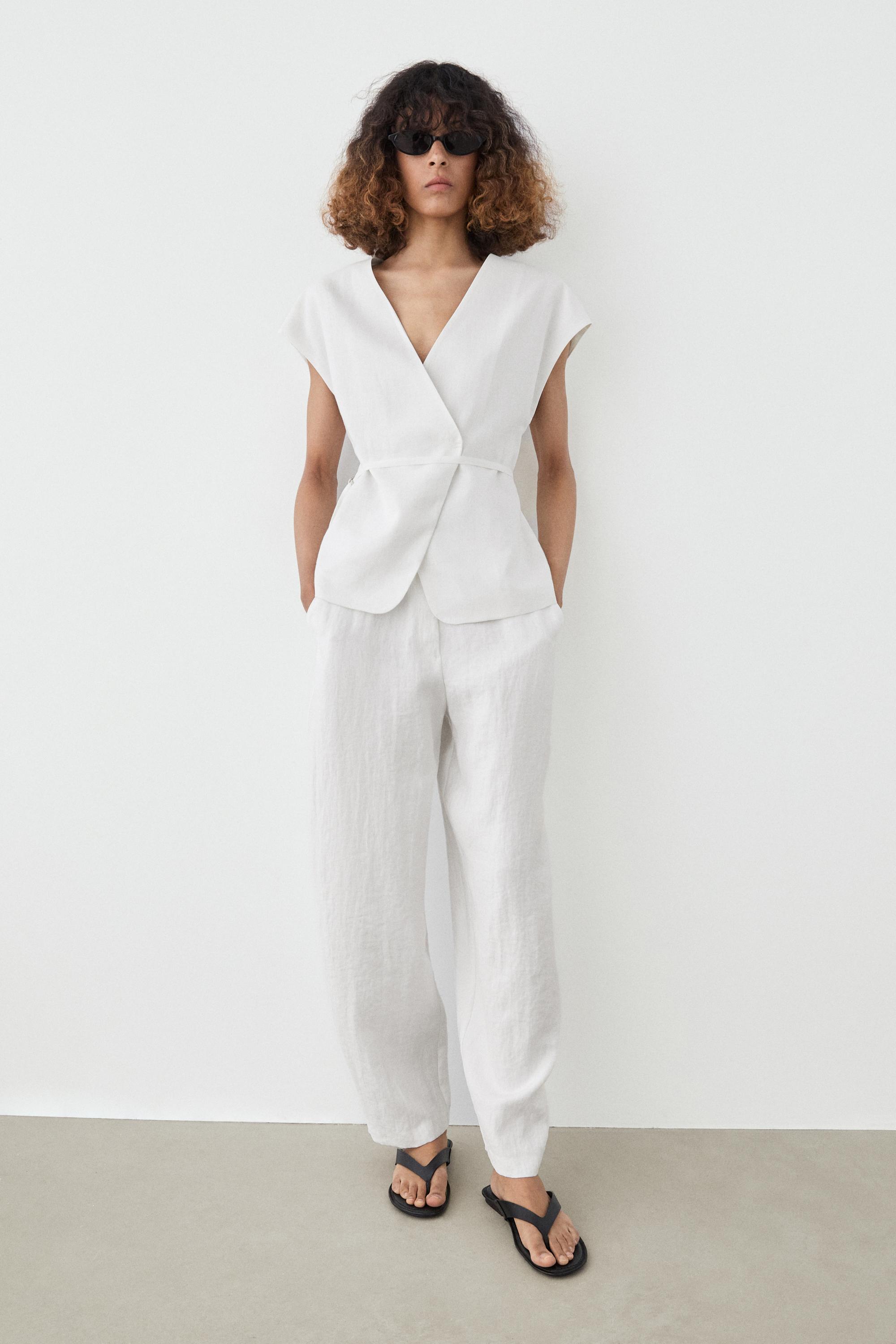 Flowing trousers with buckles — WHITE