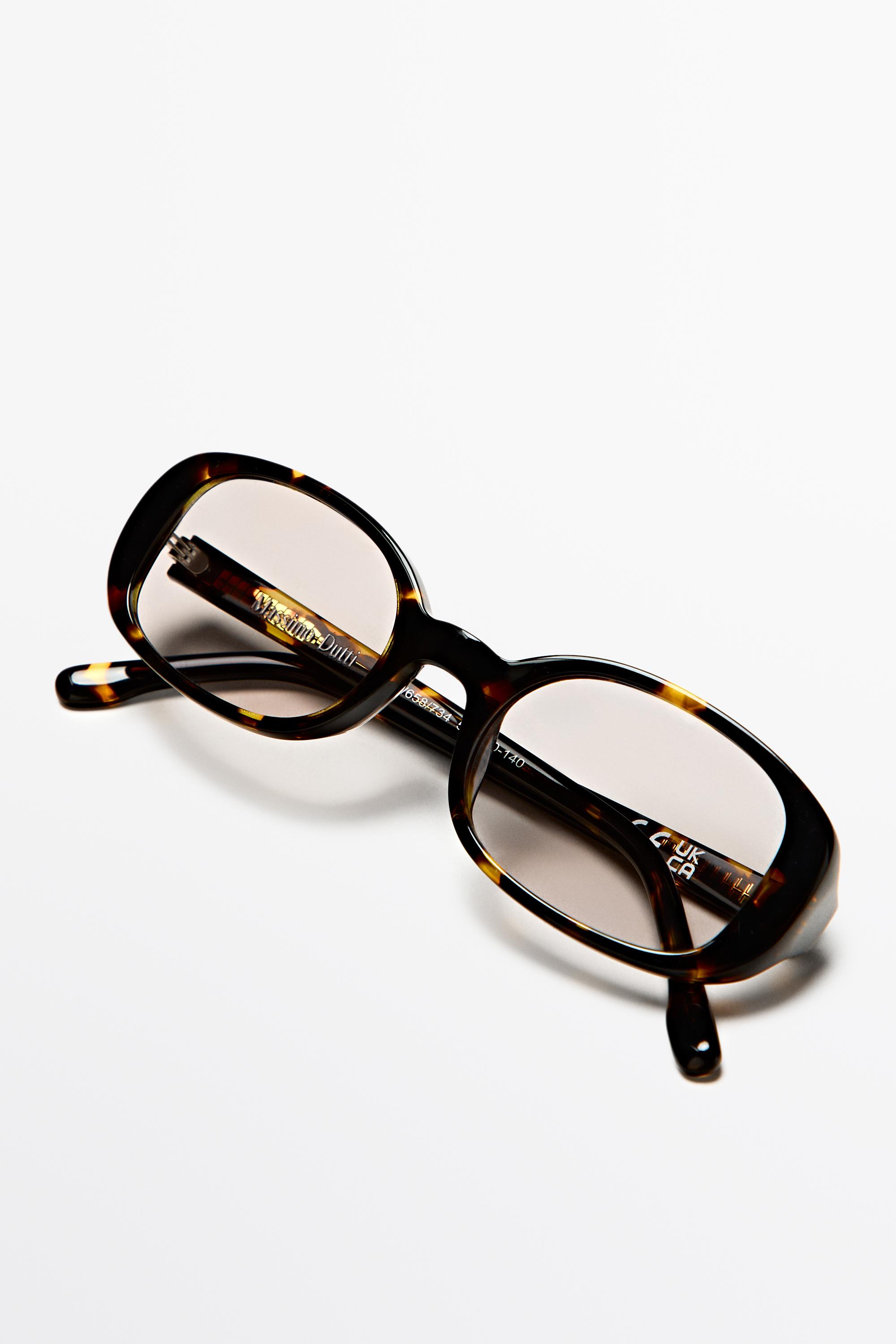 Oval tortoiseshell-effect sunglasses — BROWN