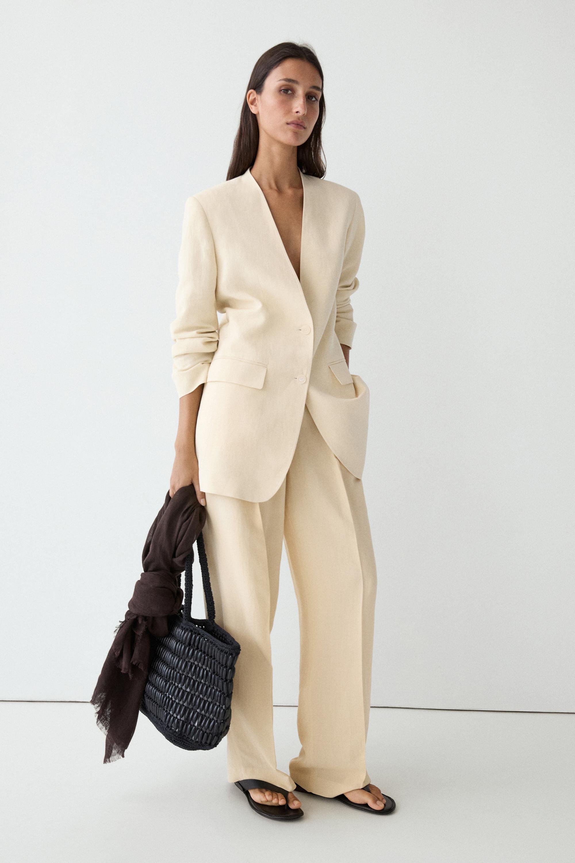 Flowing trousers with pleats — Beige