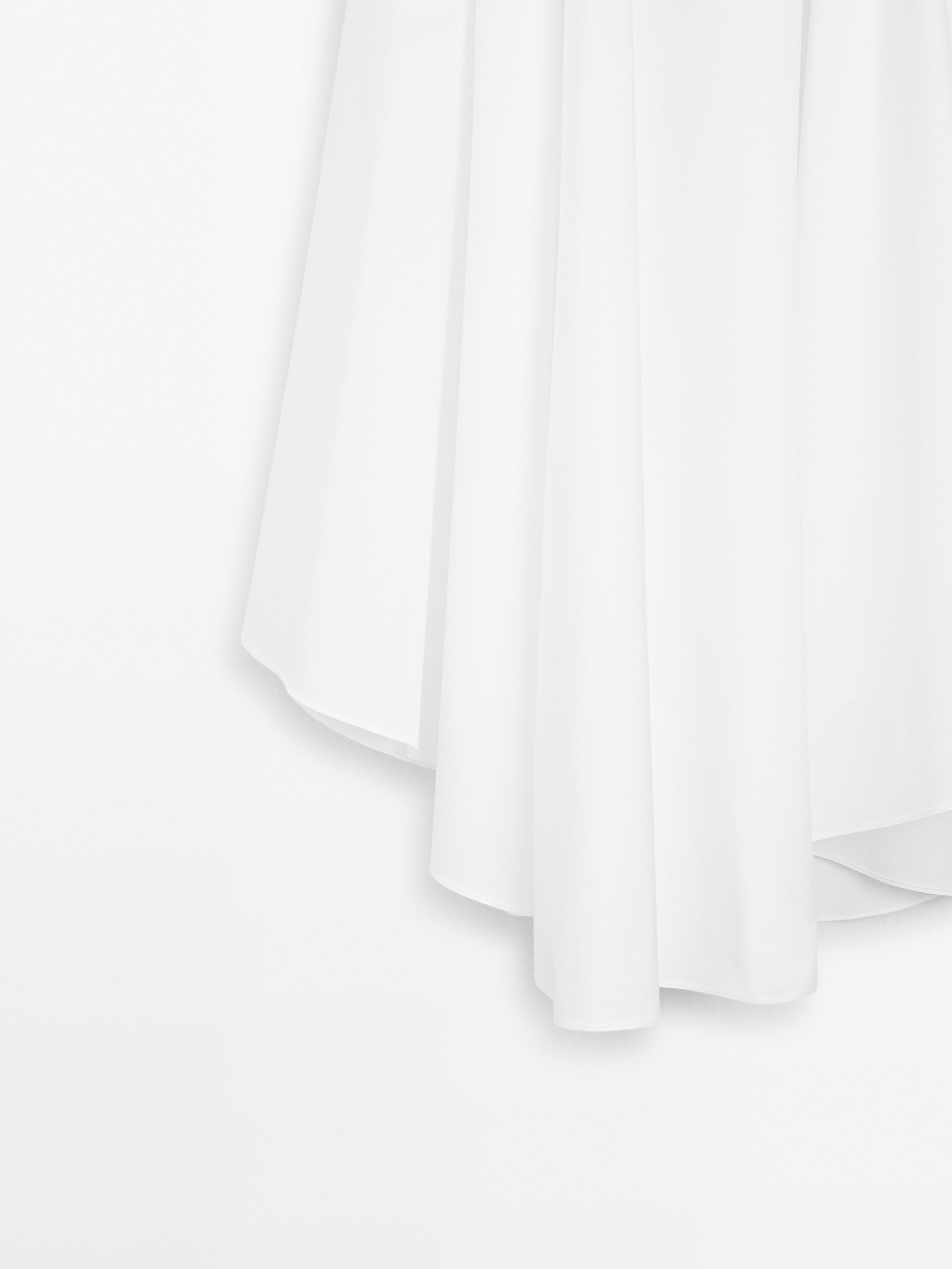 Luźna asymetryczna spódnica średniej długości