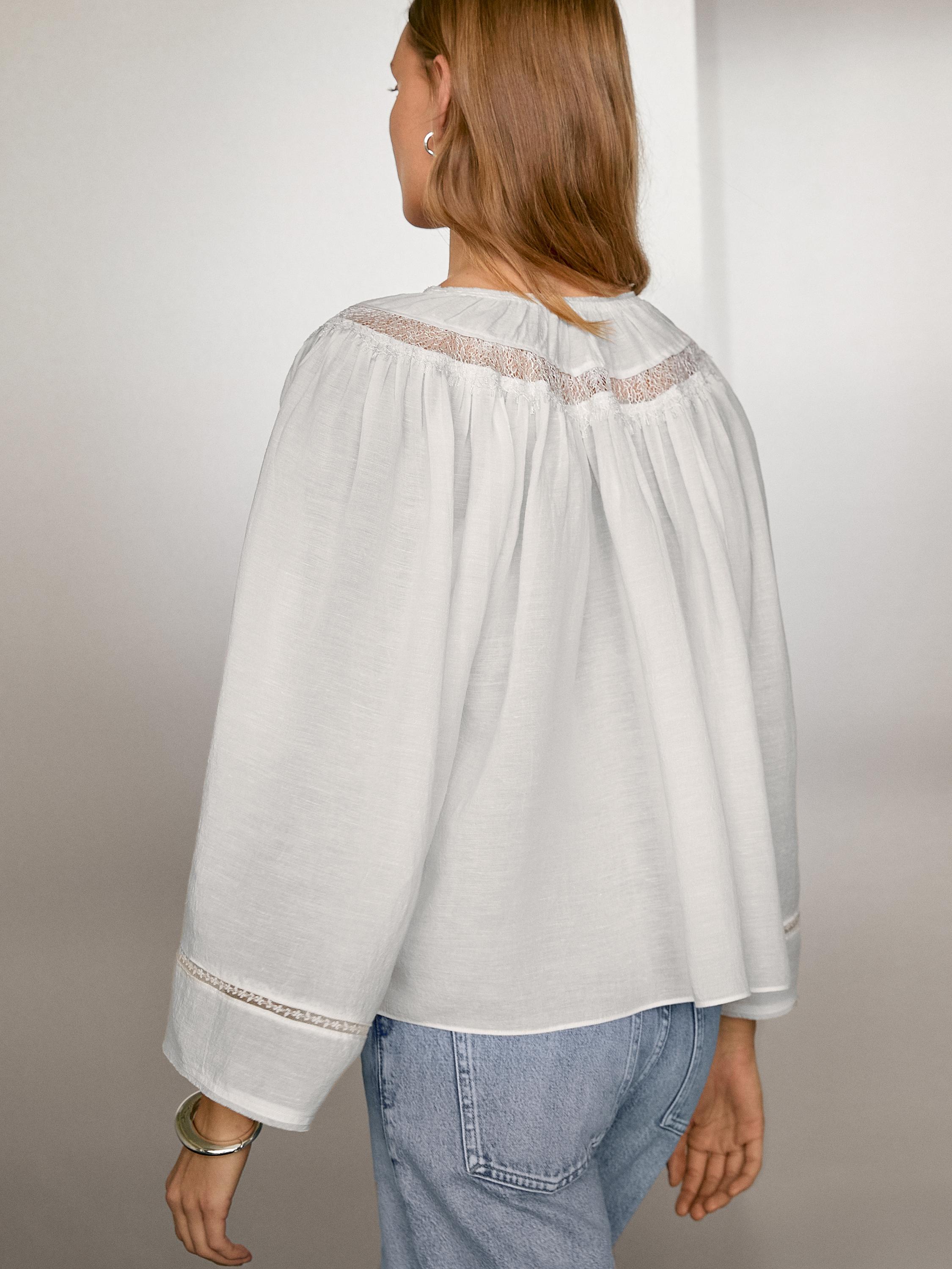 Flowing blouse with lace detail