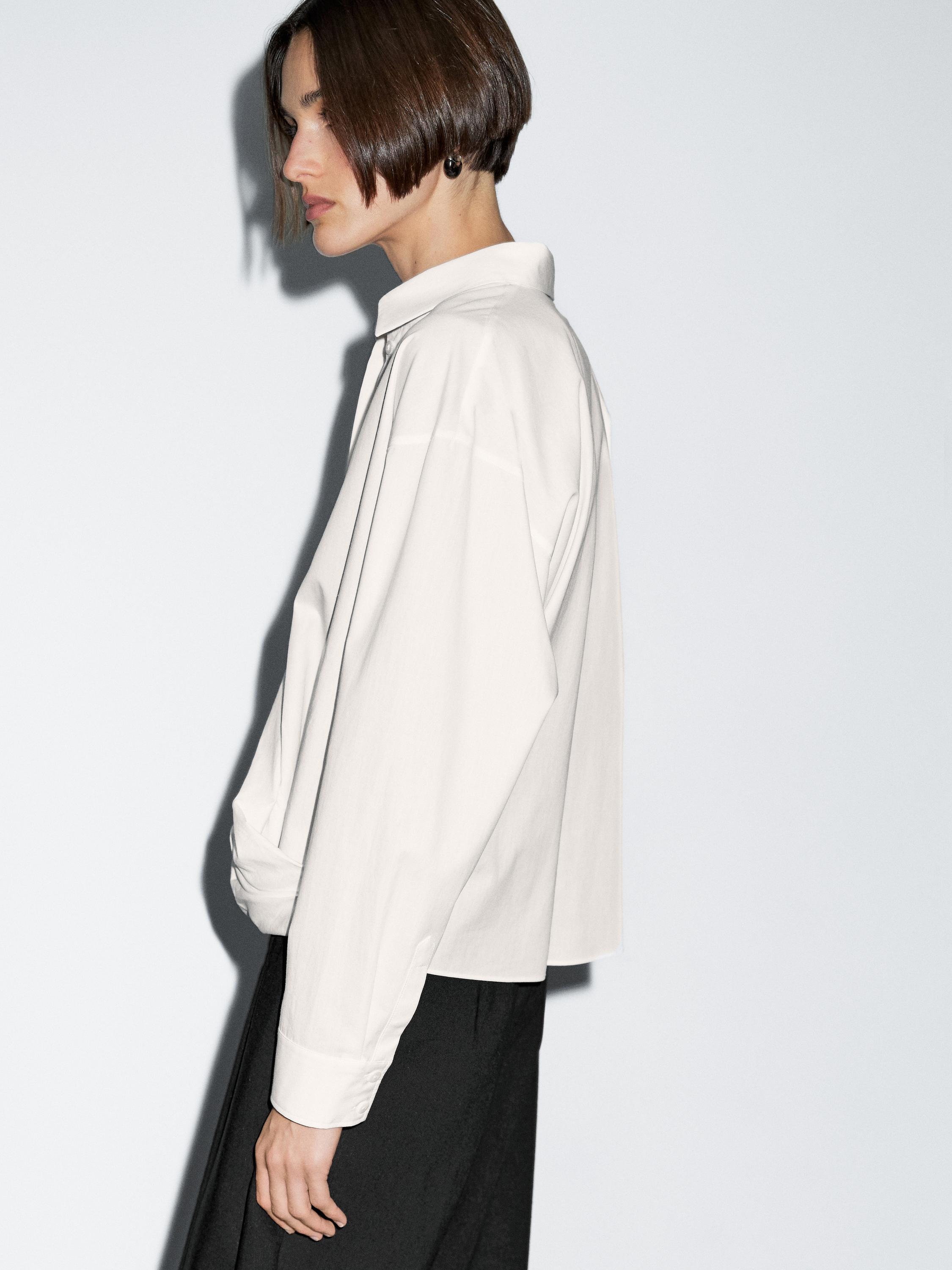 100% cotton shirt with draped asymmetric hem