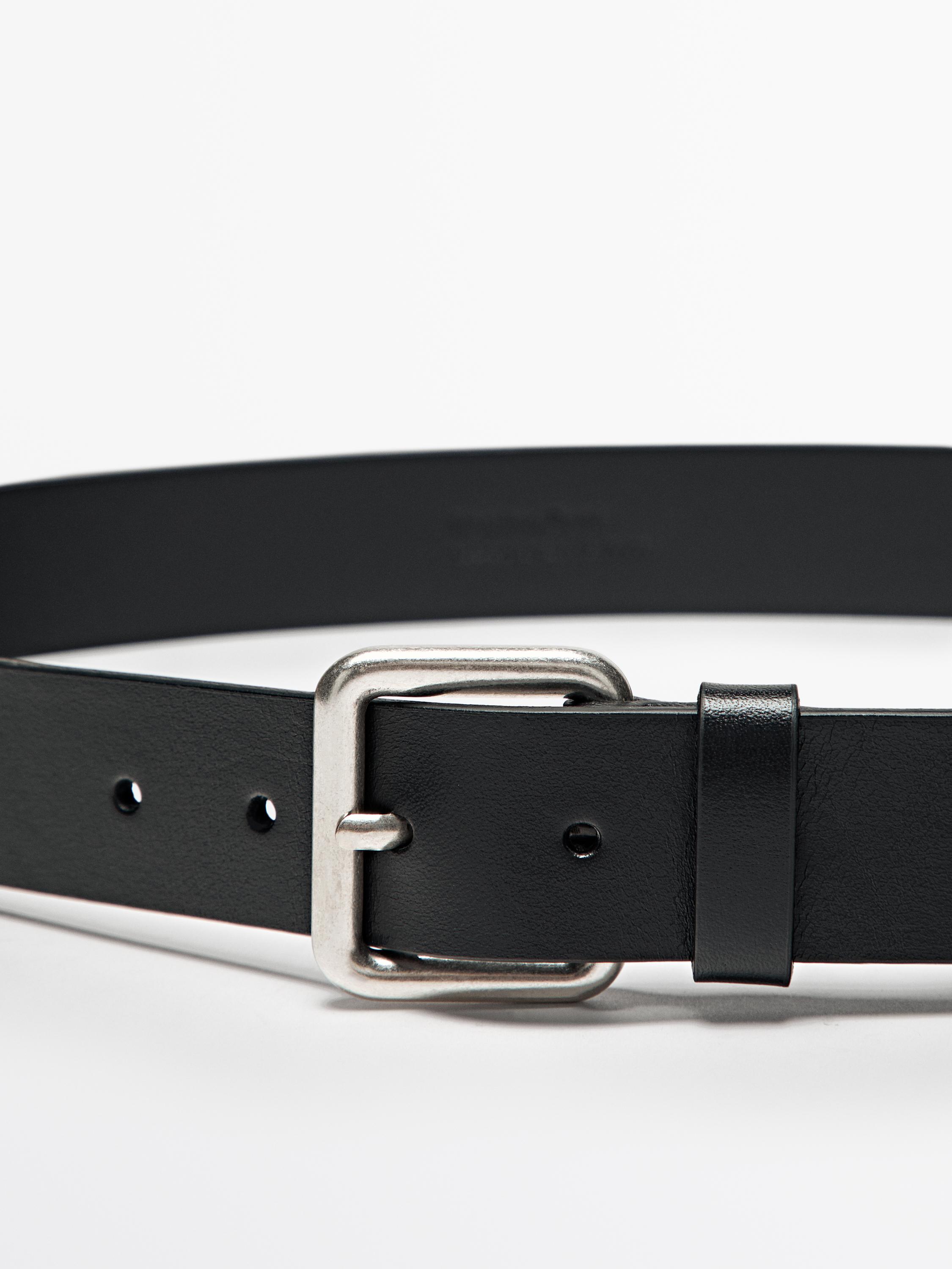 Leather belt with metallic buckle