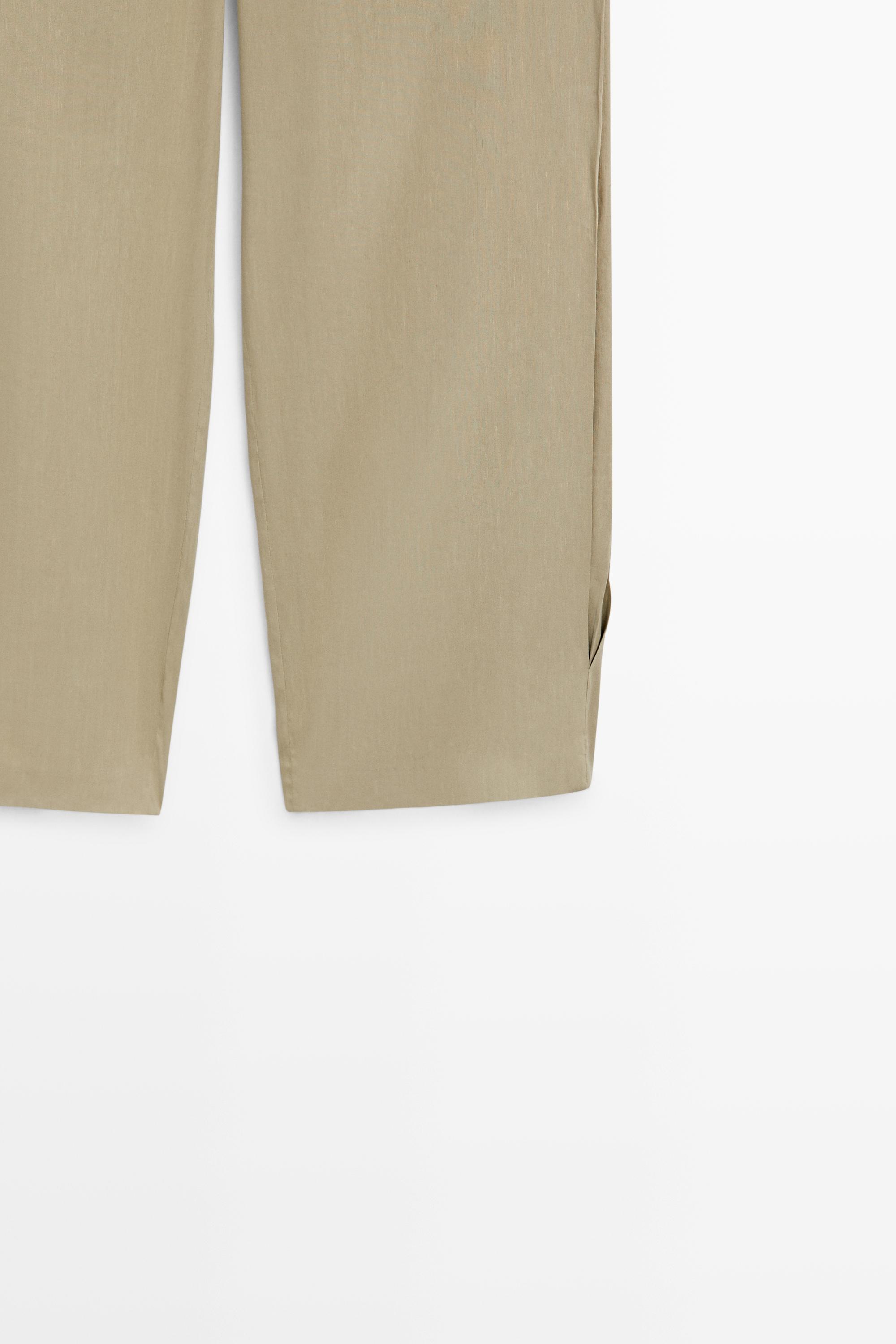 Flowing pleated pants - STUDIO — PALE KHAKI
