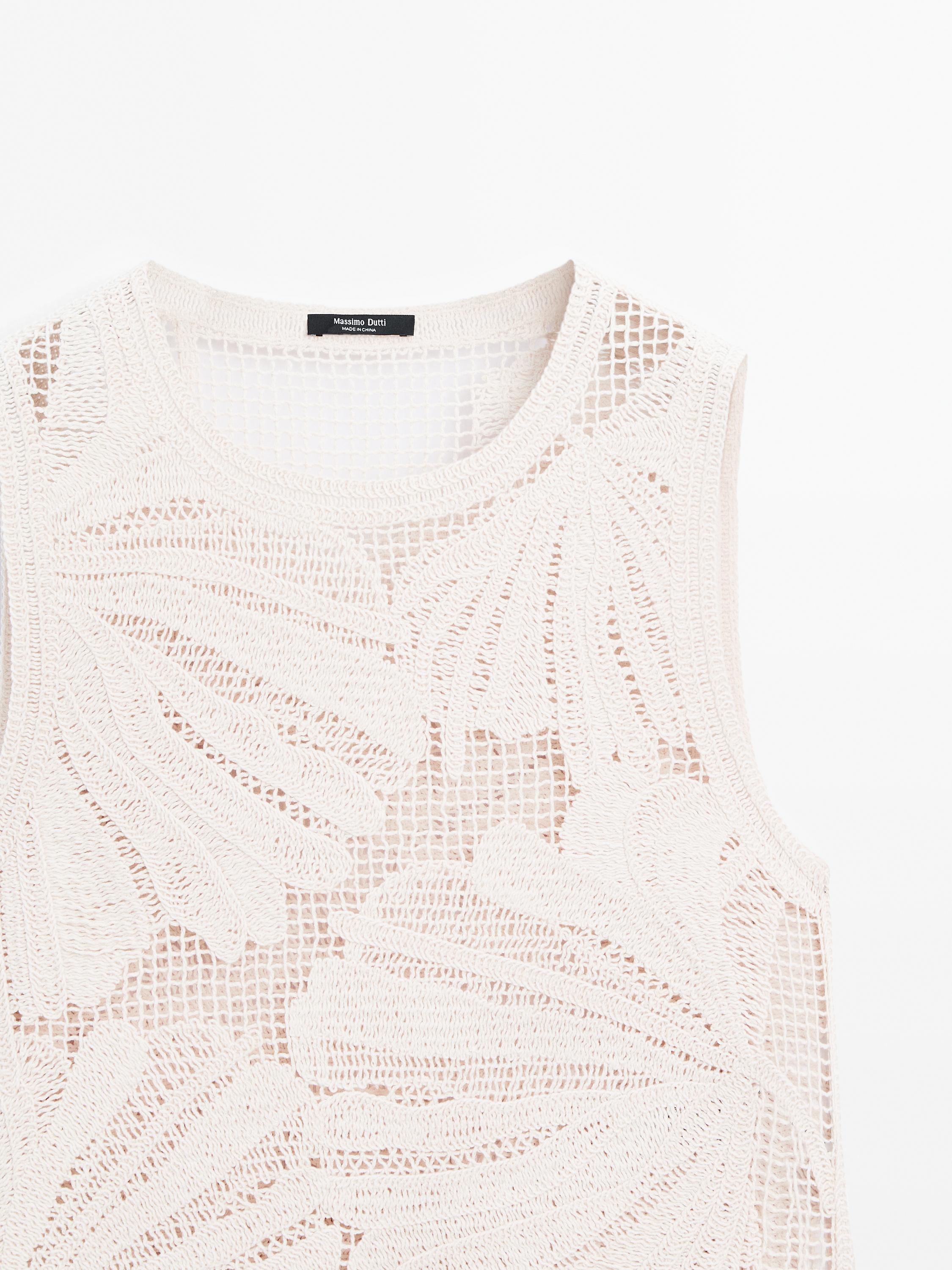 Openwork crochet top with floral detail