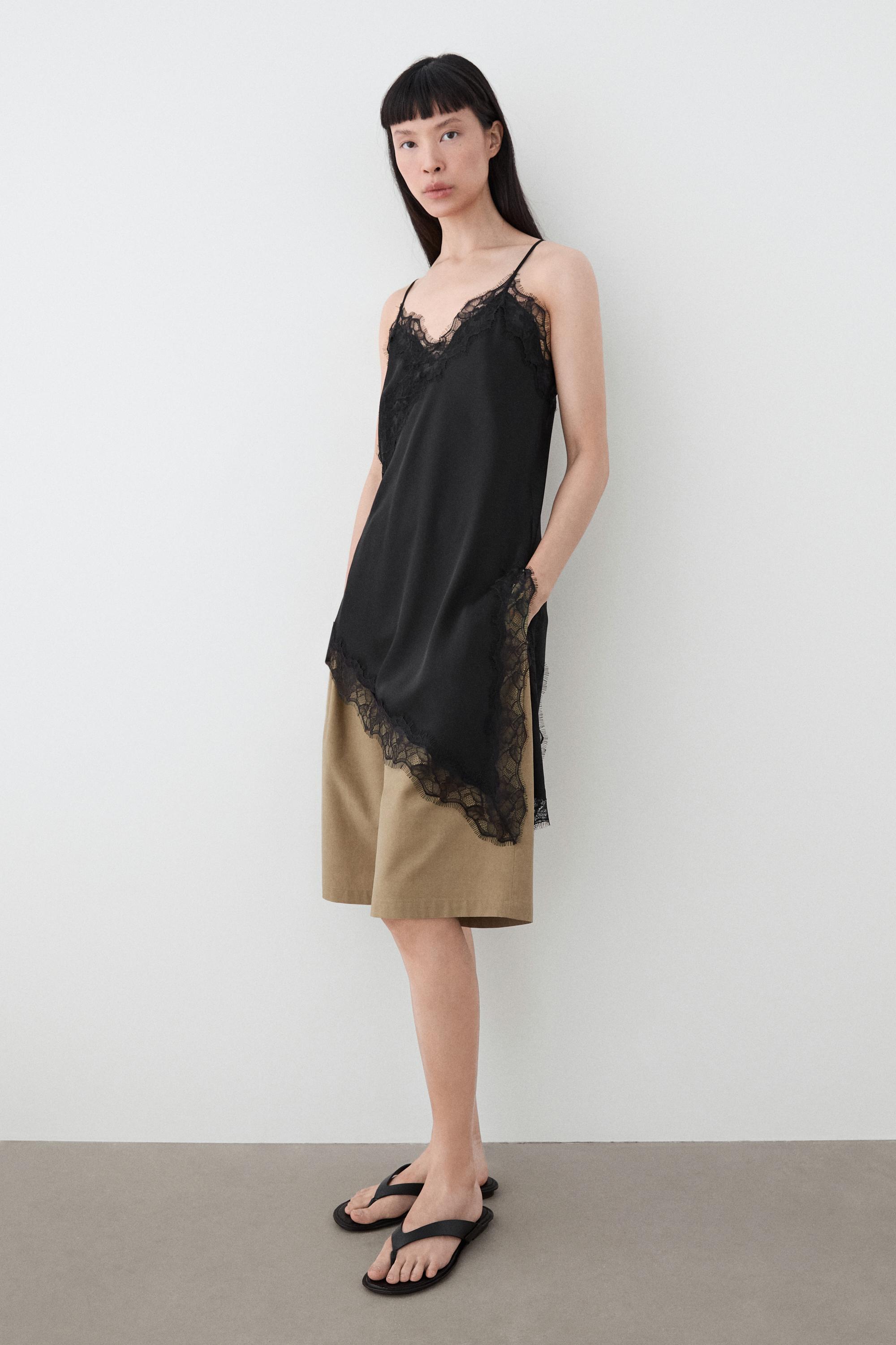 Asymmetric thin strap camisole top — BLACK