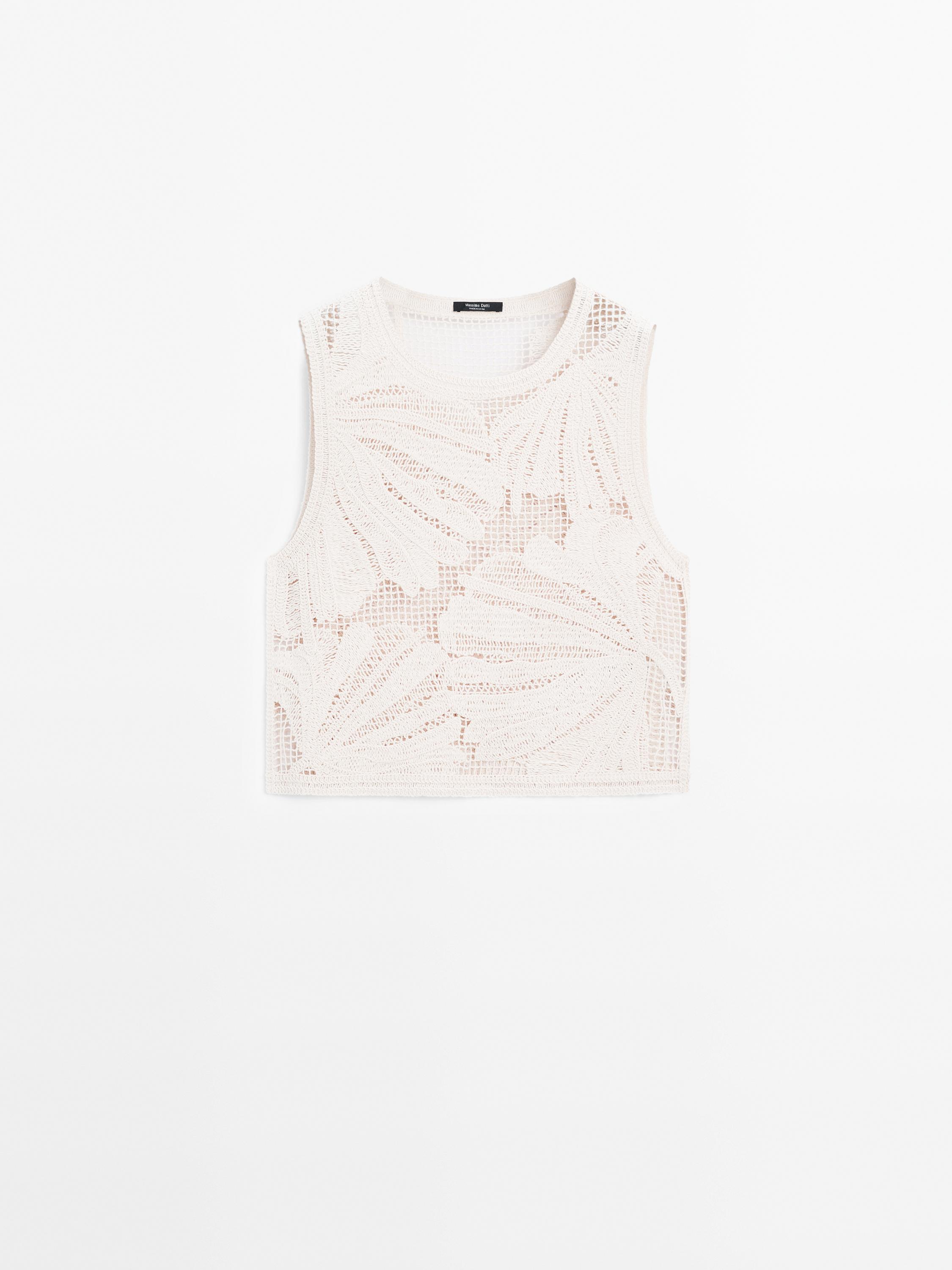 Openwork crochet top with flower detail