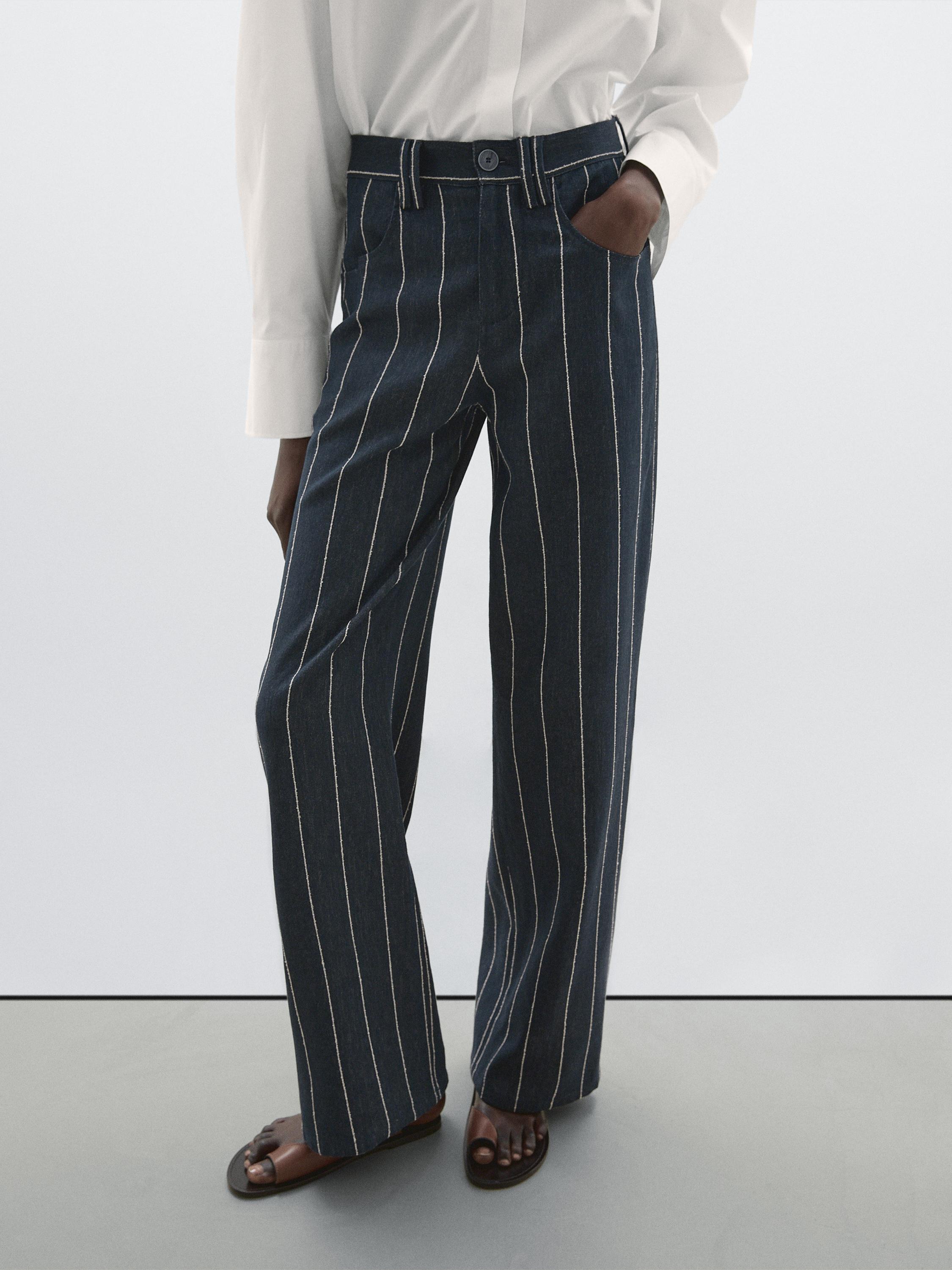 بنطلون بخصر متوسط وساق عريضة