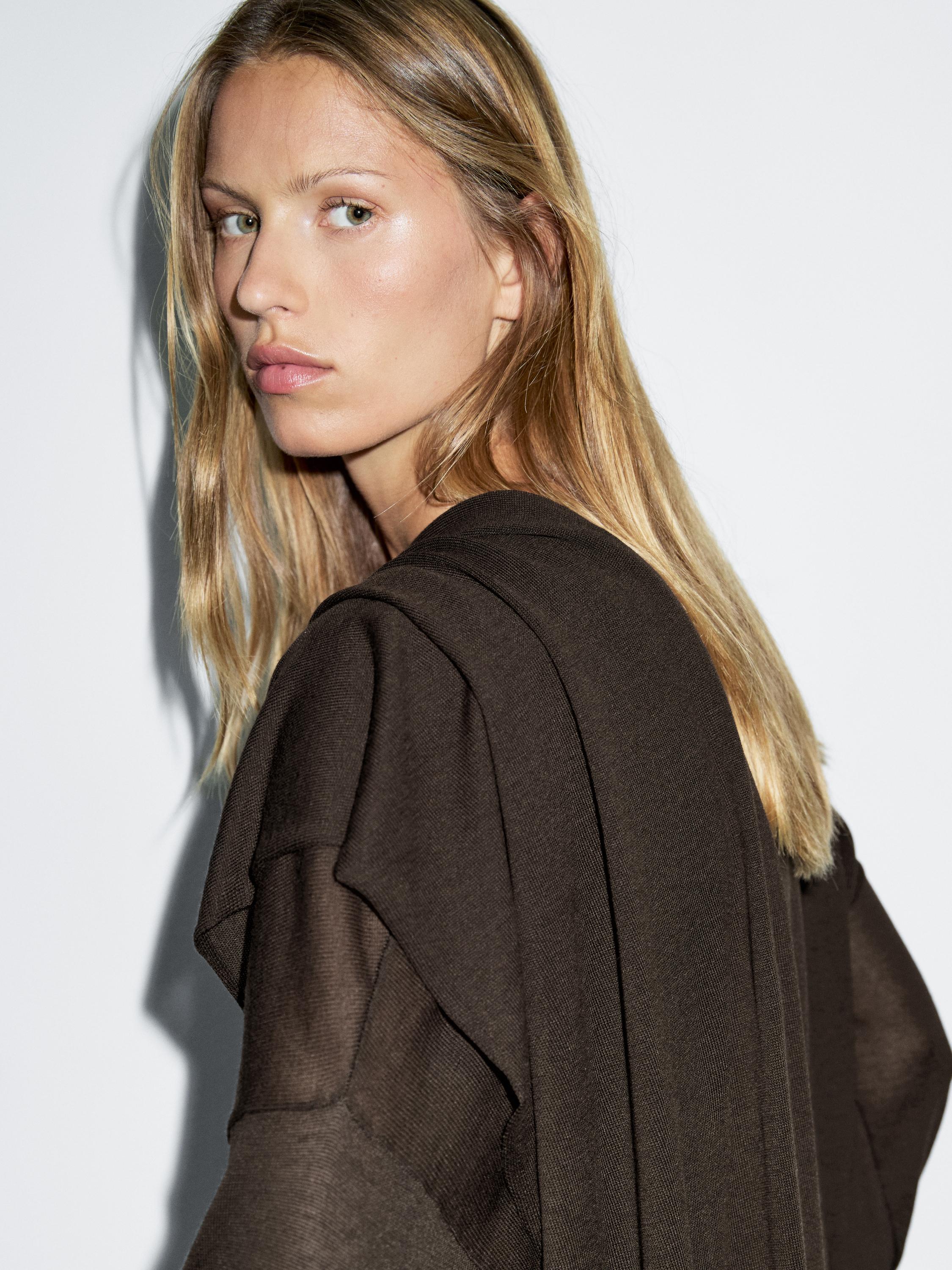 Knit sweater with scarf detail