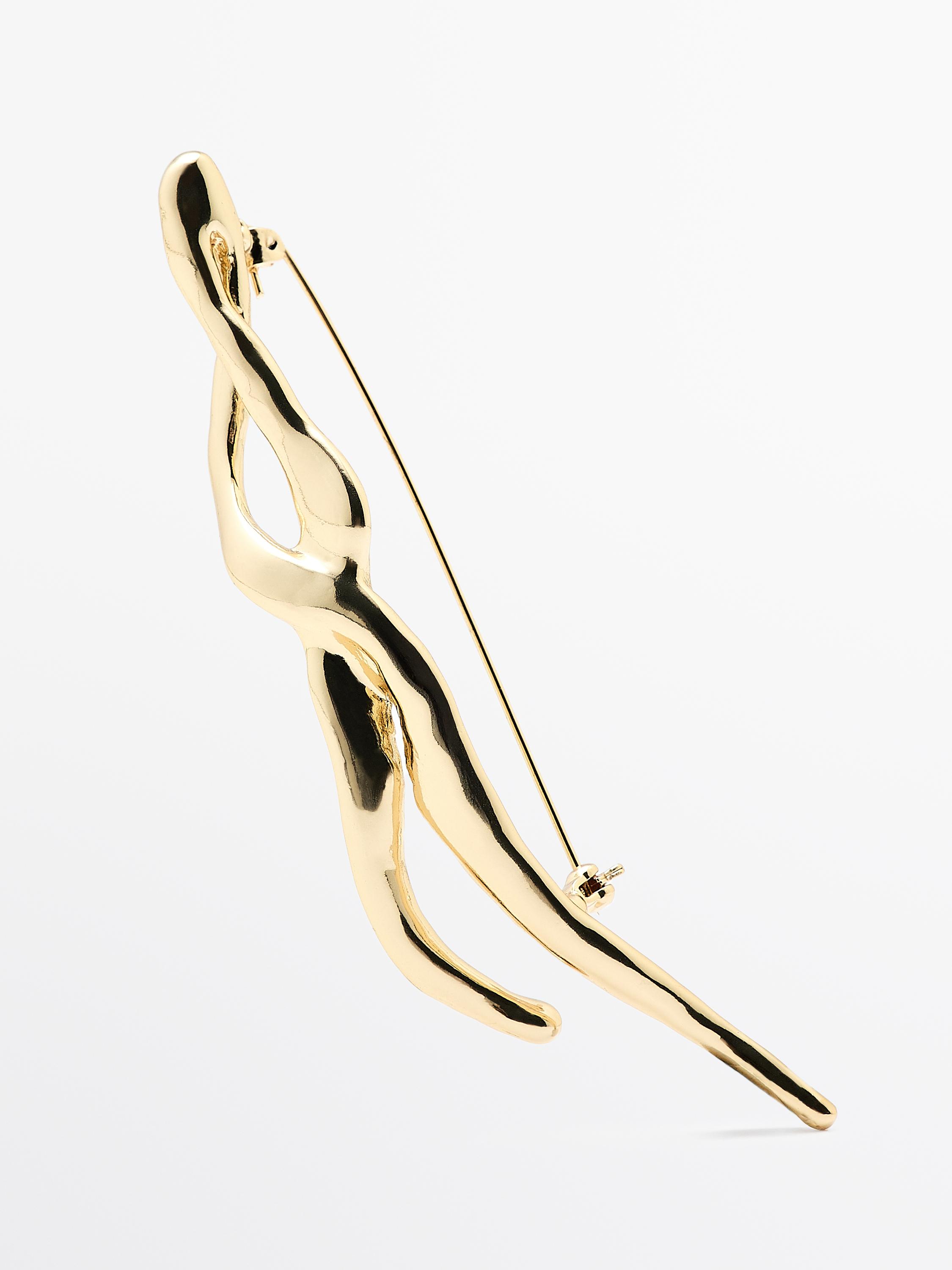 Broche metálico abstracto