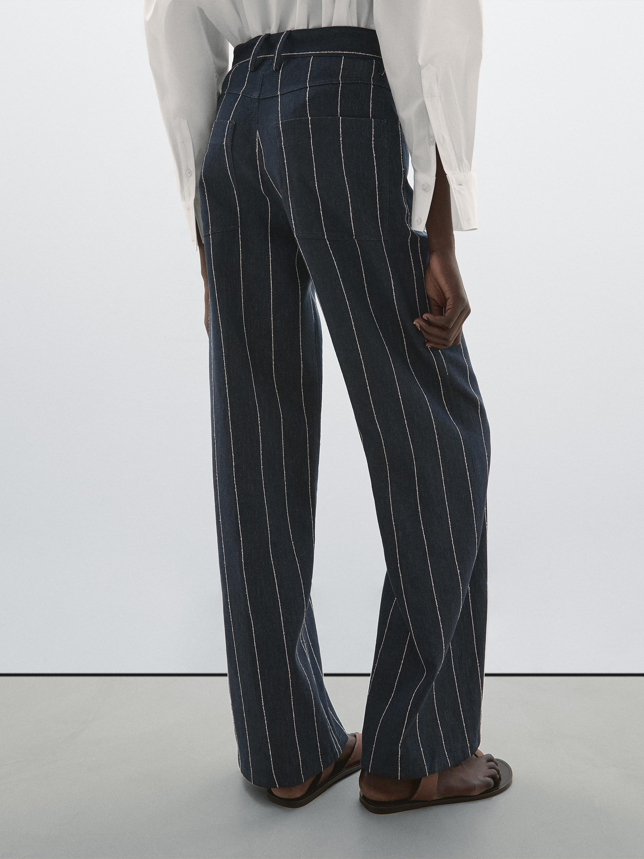 بنطلون بخصر متوسط وساق عريضة