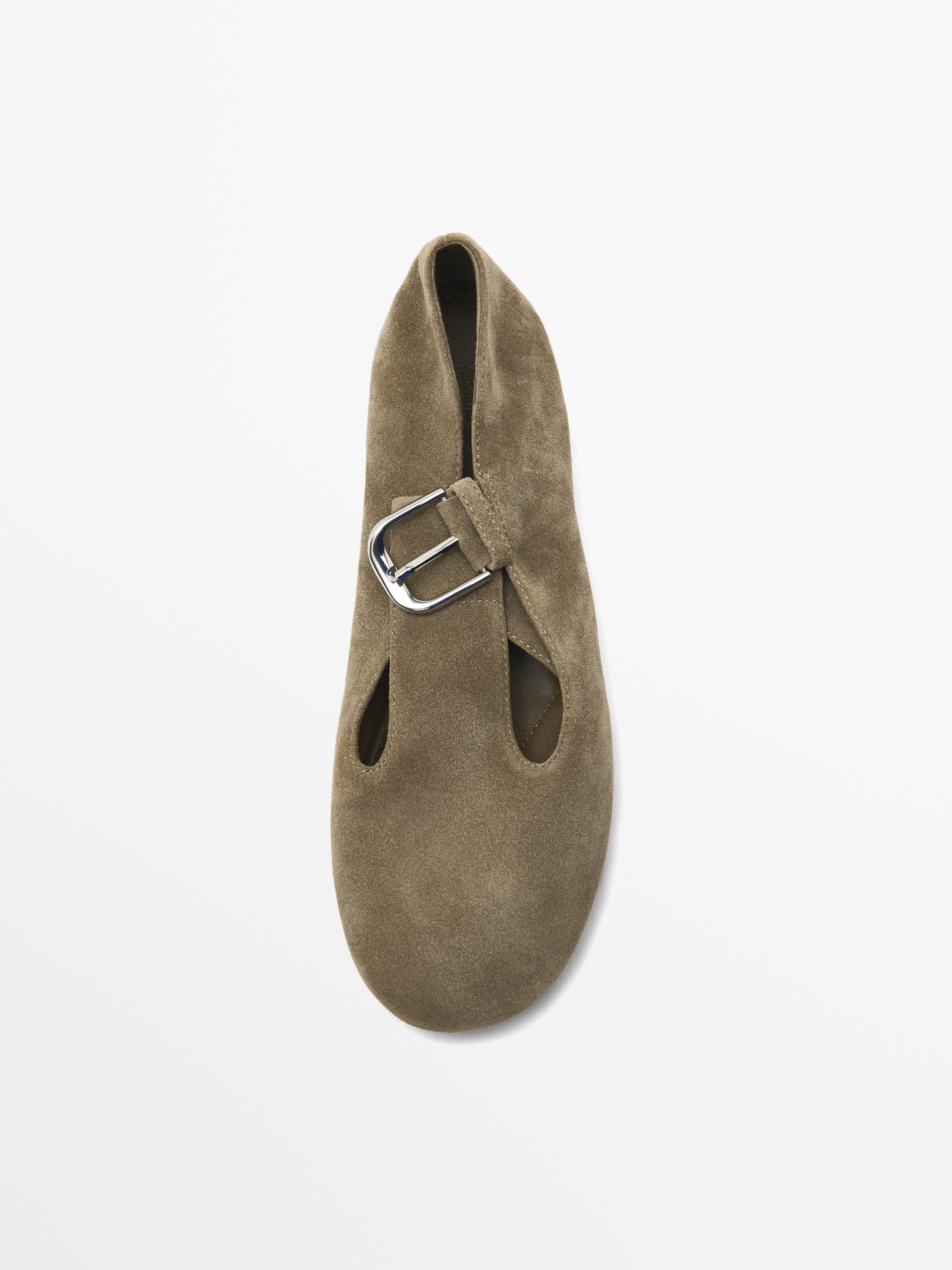 Flat shoes with buckled strap