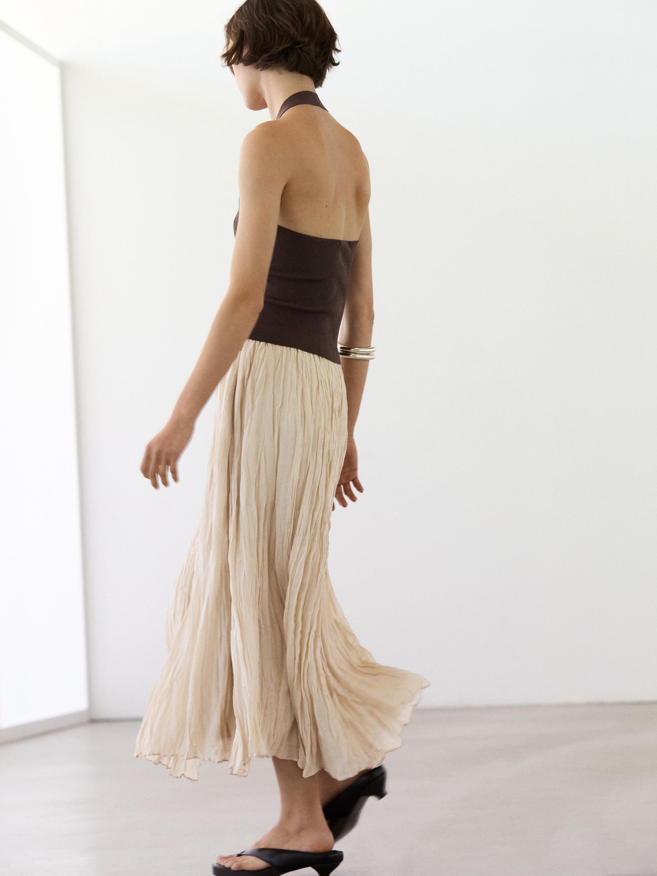 Flowing midi skirt with pleated detail — CREAM