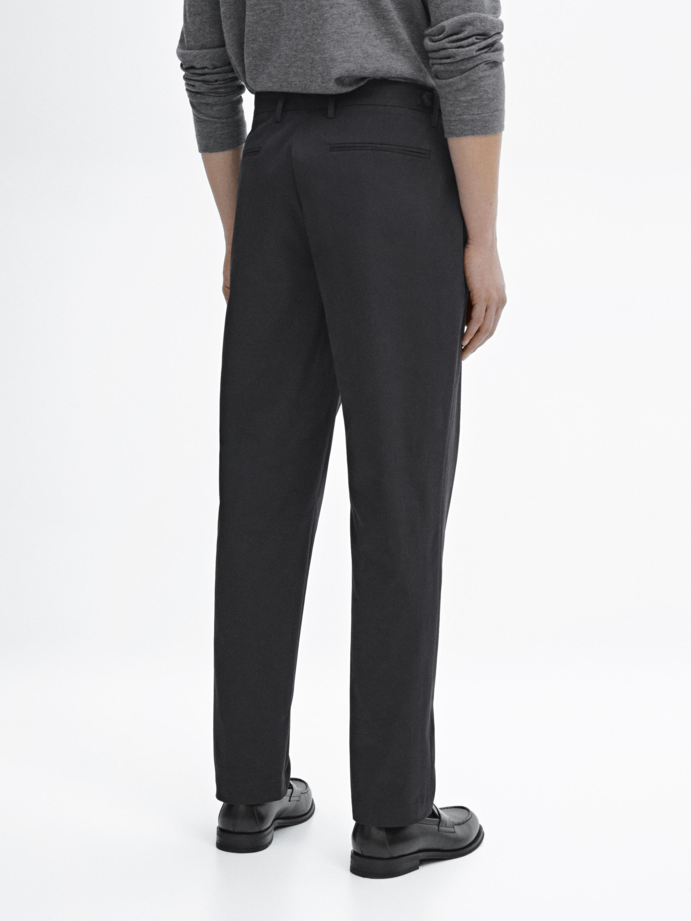Tapered fit trousers with buckle detail