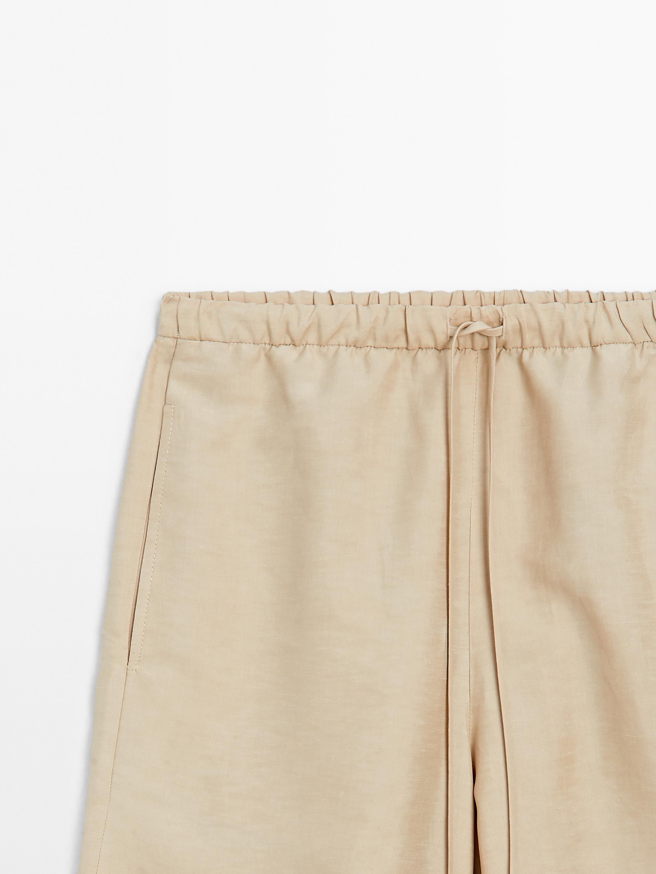 Flowing linen blend barrel fit trousers