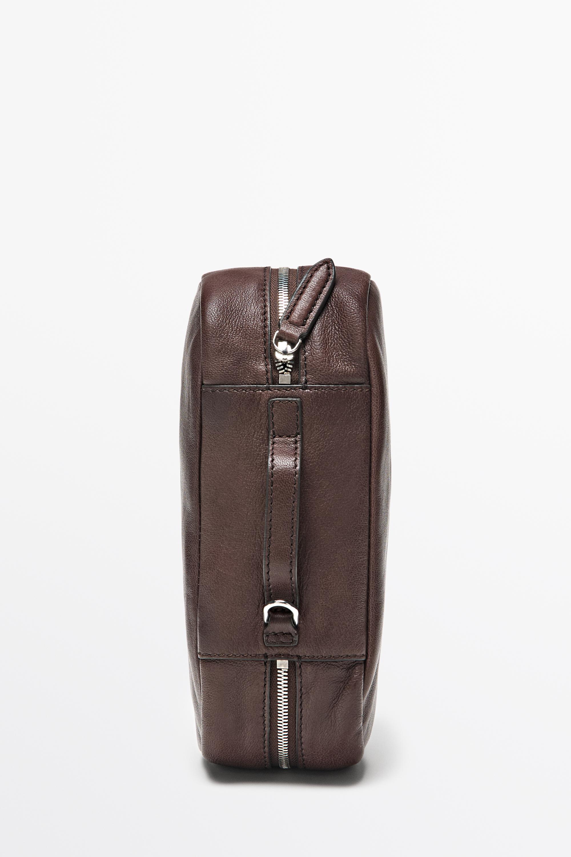 Oval nappa leather toiletry bag — BROWN
