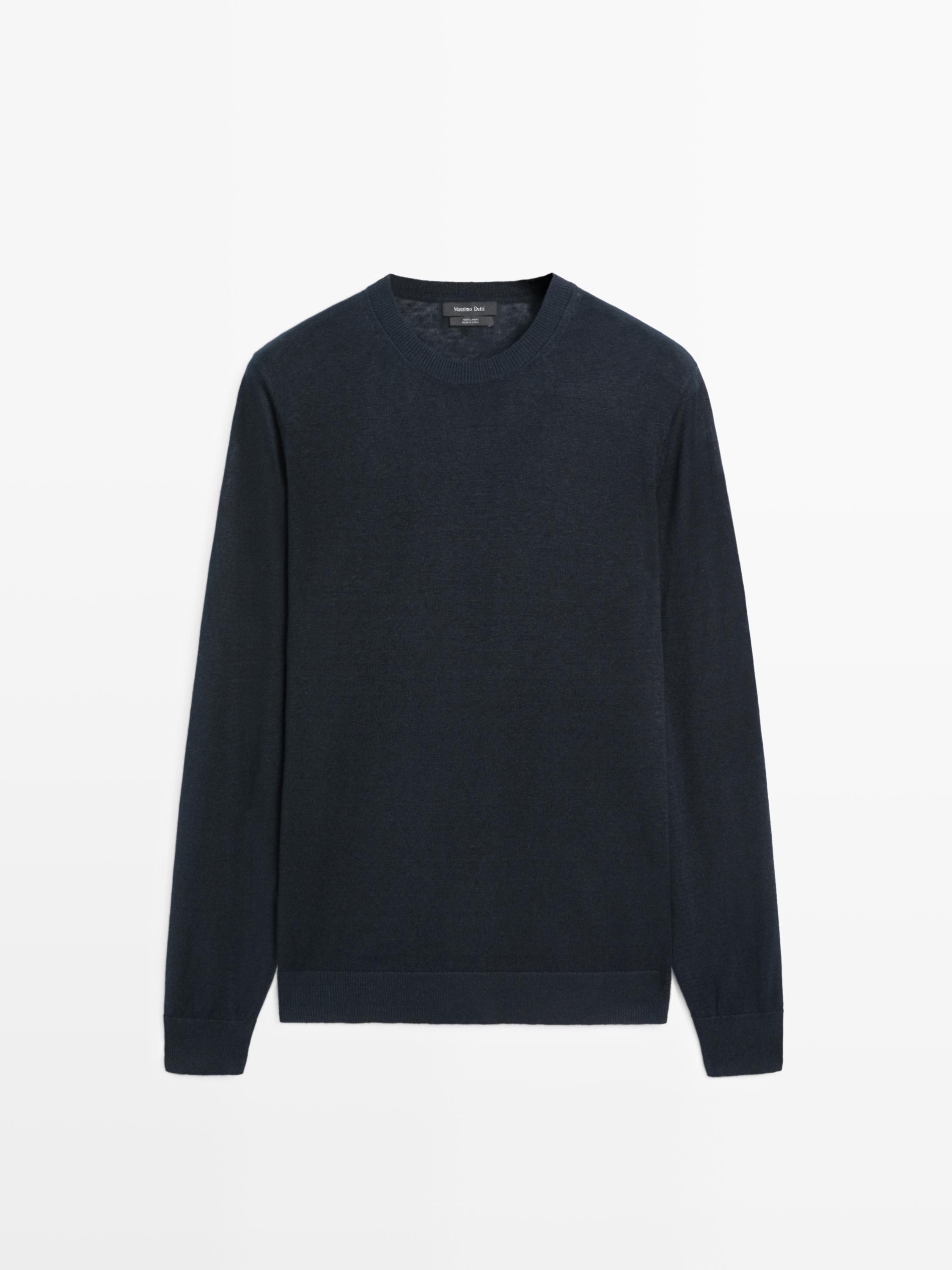 Front view of a navy blue knit sweater with a round neck and long sleeves.