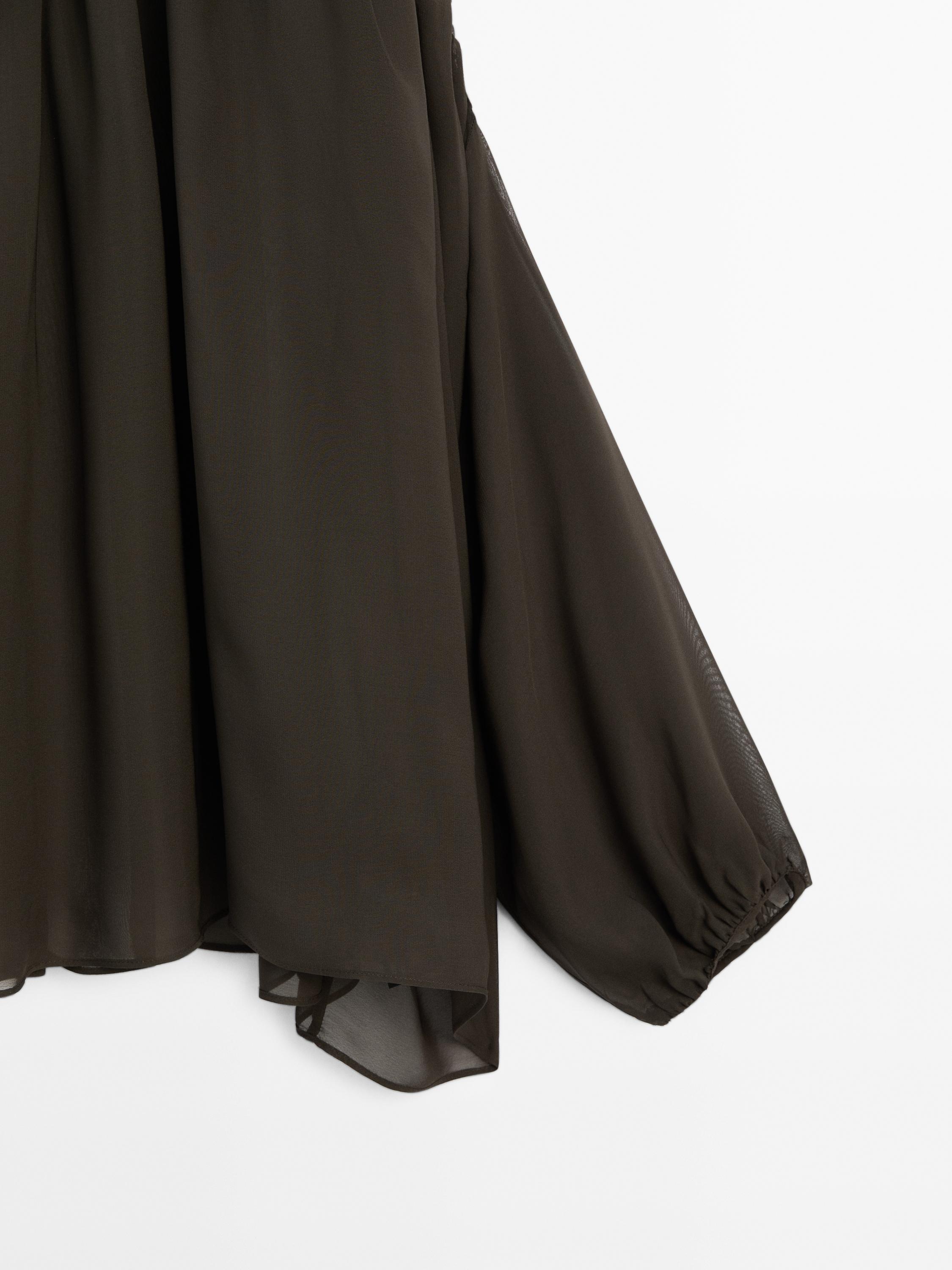 Voluminous flowing blouse with button details
