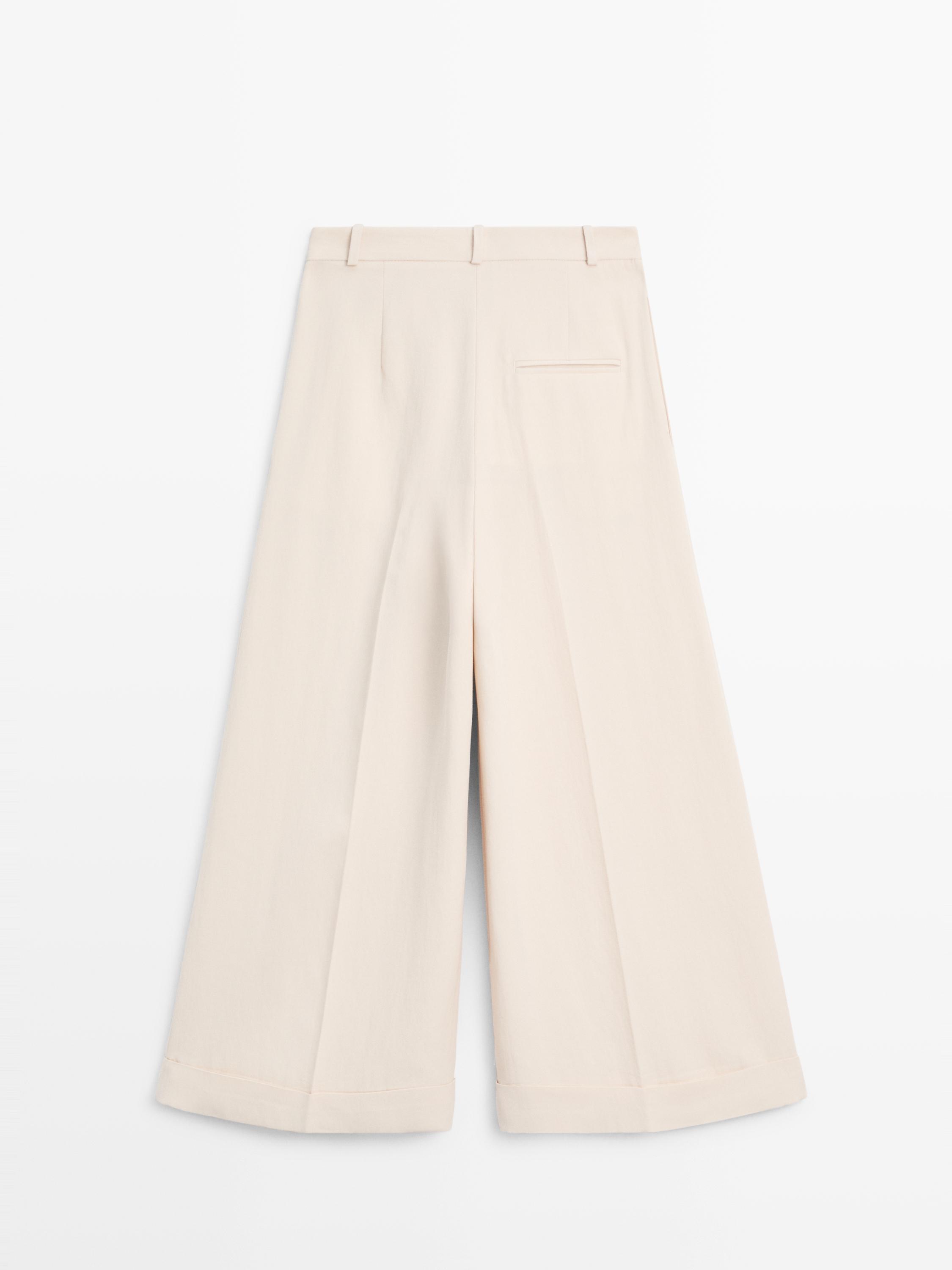 Flowing trousers with turn-up hems — CREAM