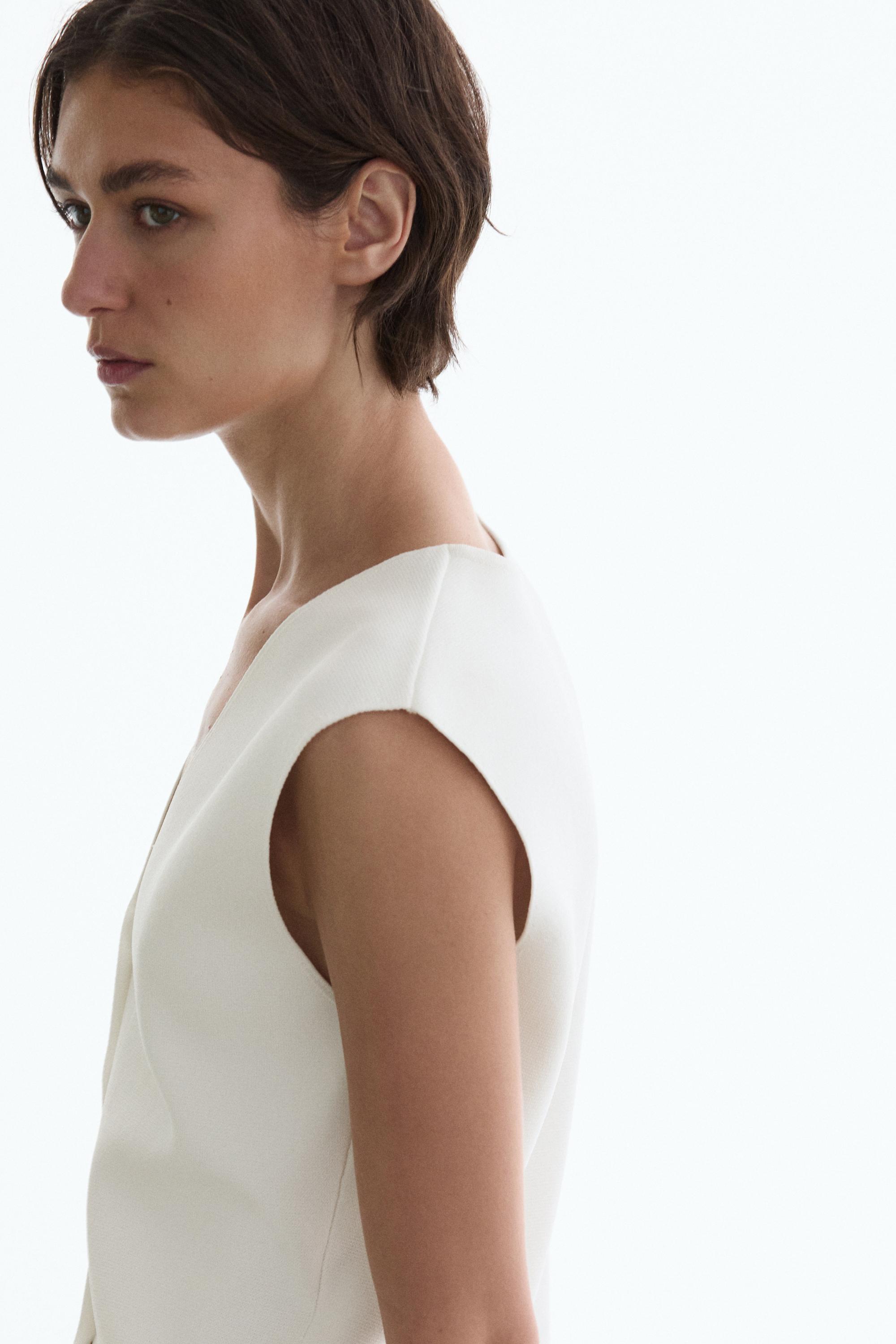 Knit waistcoat with button details — WHITE