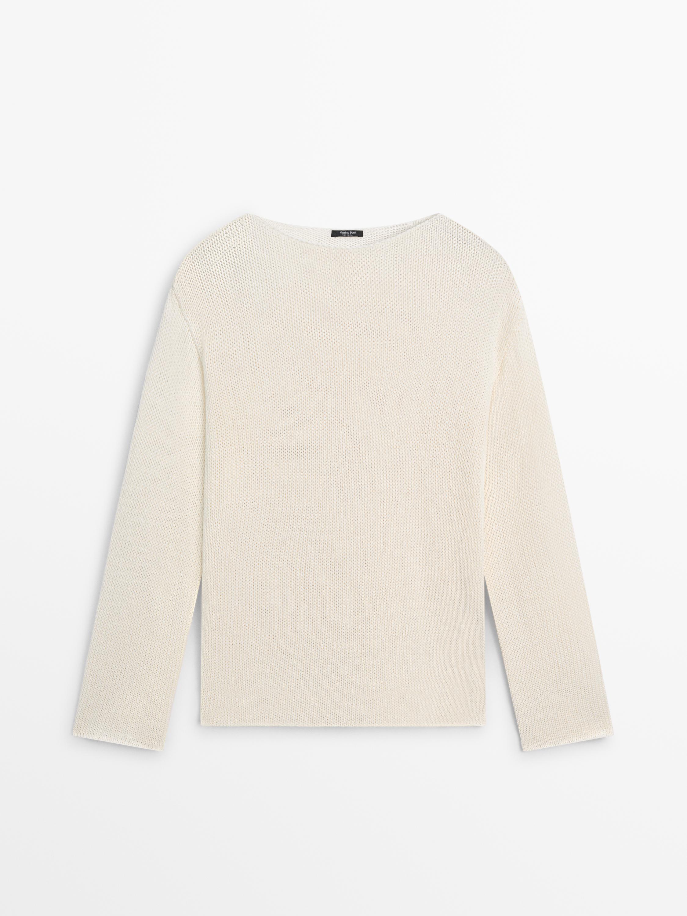 Front view of a raw open-knit jersey with a round neck and long sleeves.