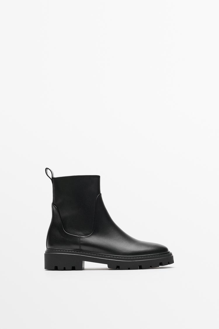 Flat leather ankle boot with track sole — BLACK