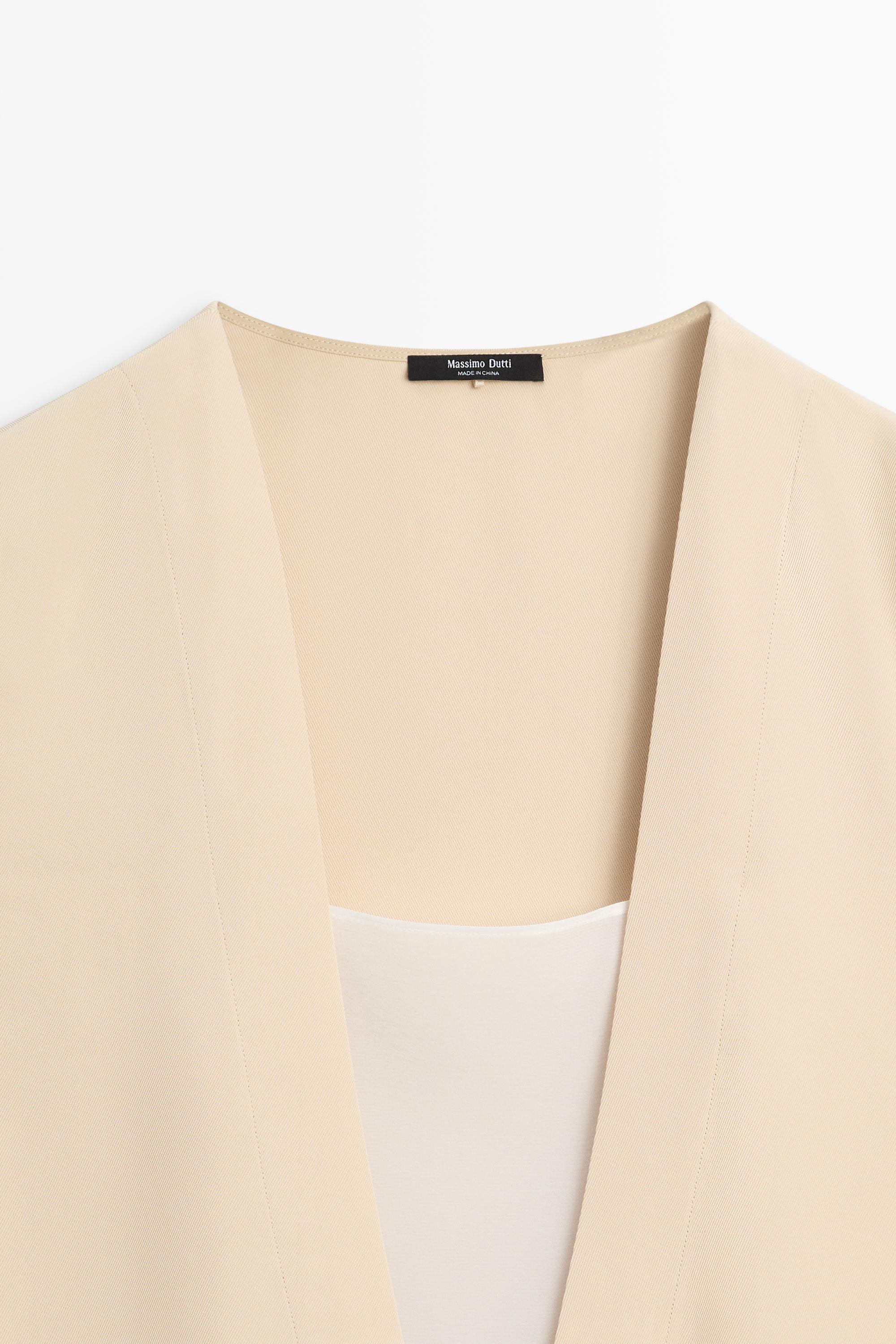 Flowing double-layer top with contrast detail — CREAM