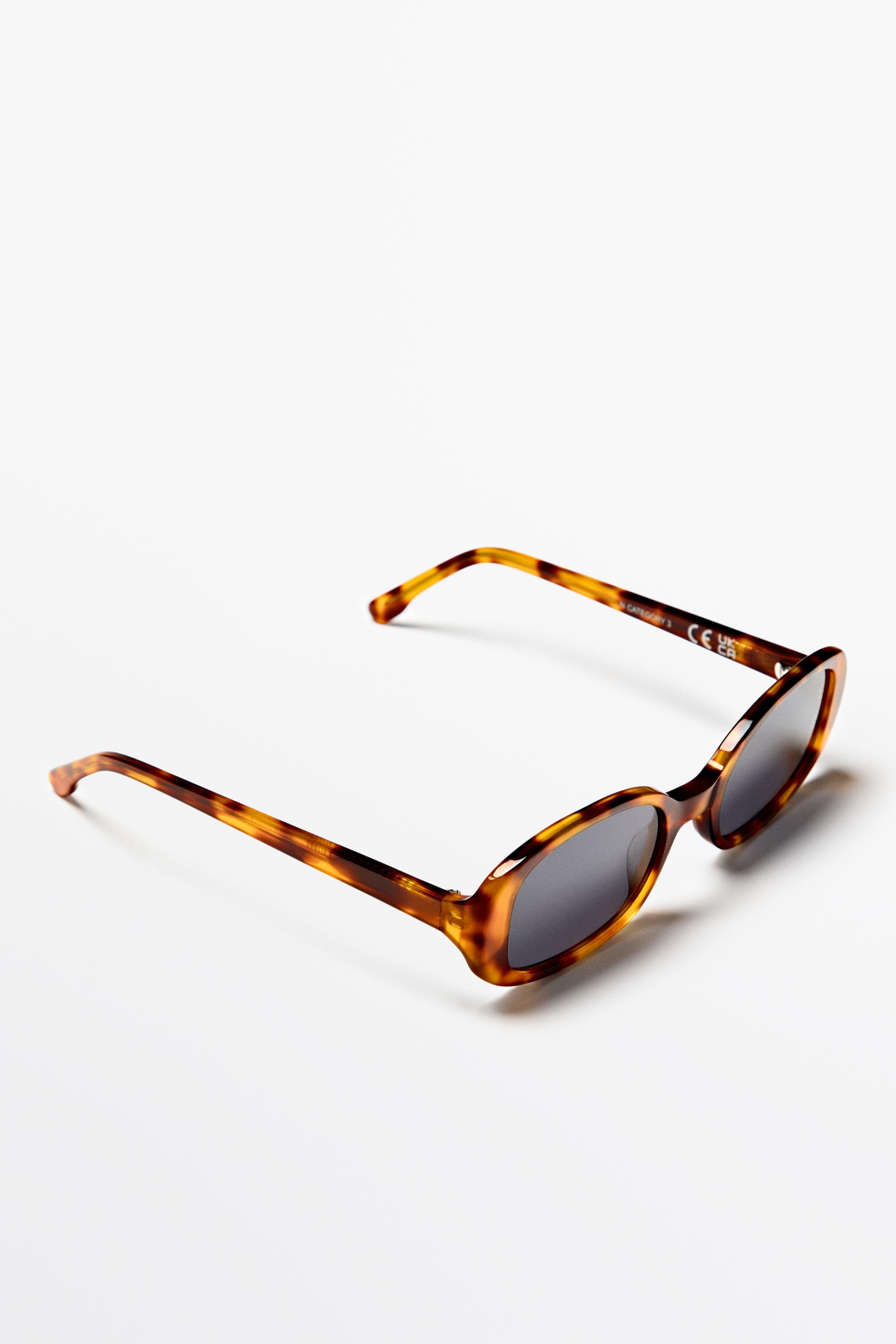 Oval tortoiseshell-effect sunglasses — Light Blue