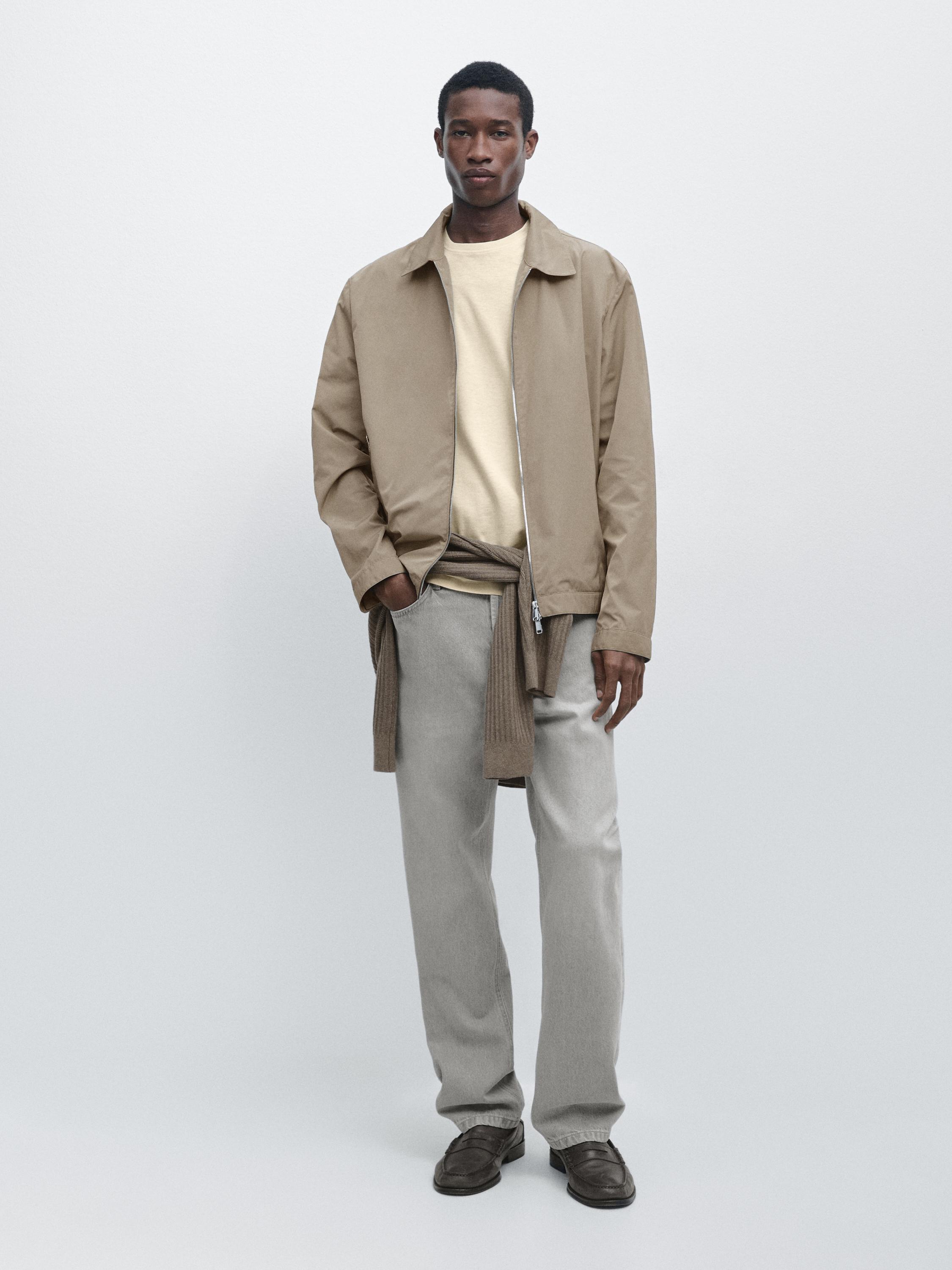 Mink short jacket set with zipper, beige t-shirt, gray pants, and brown shoes.