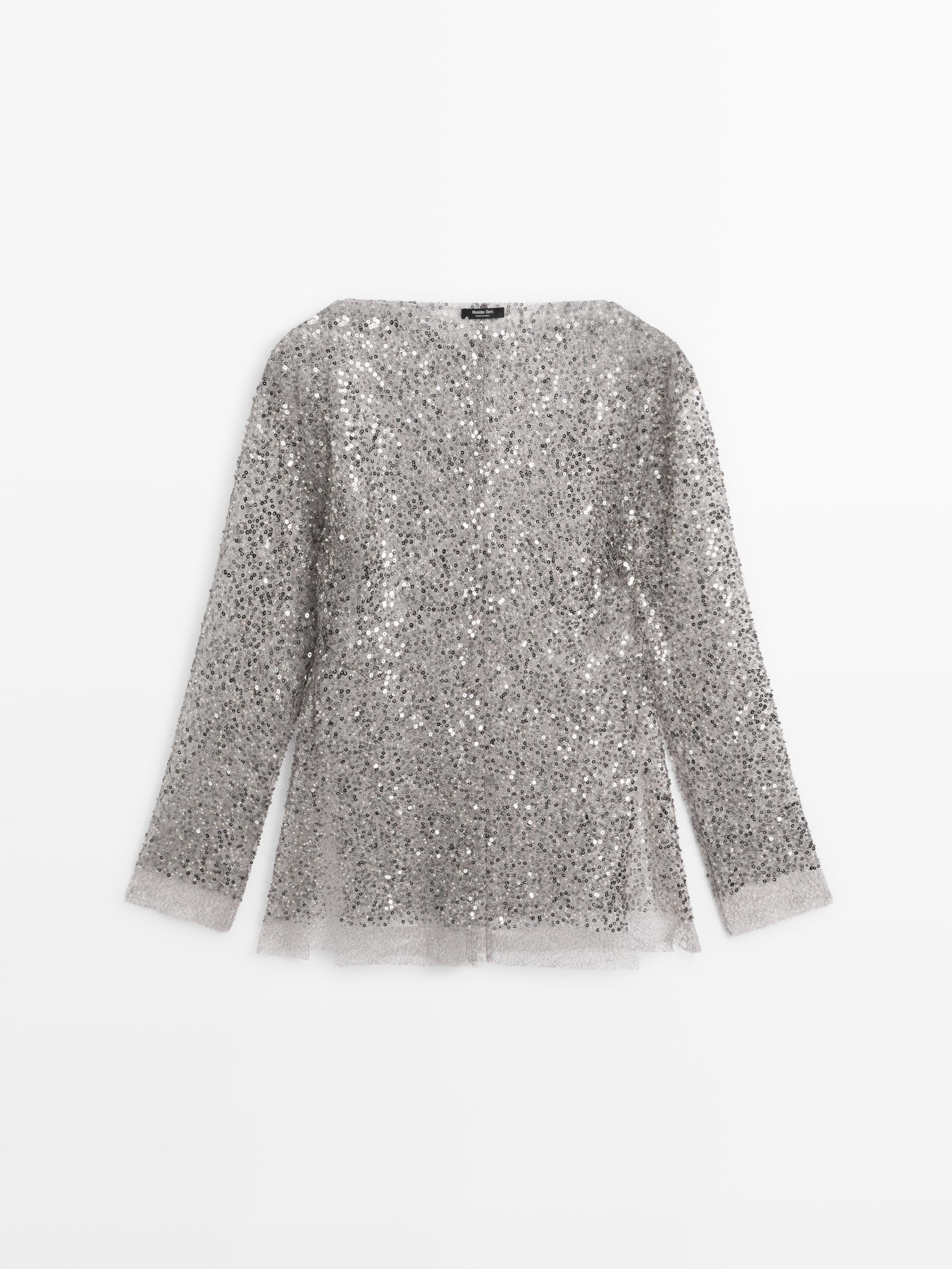 Blus med paljetter och draperad krage