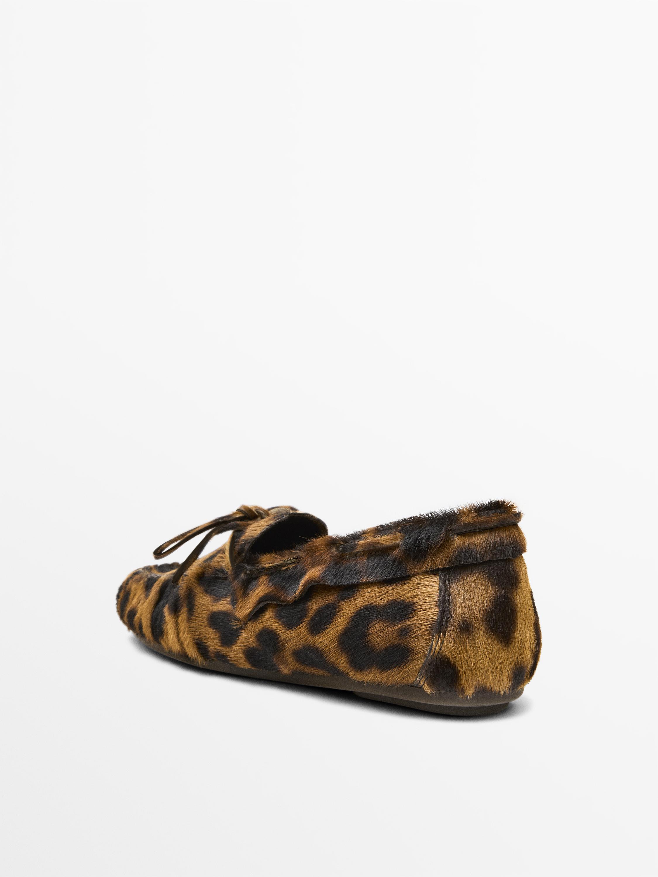 Animal print deck shoes