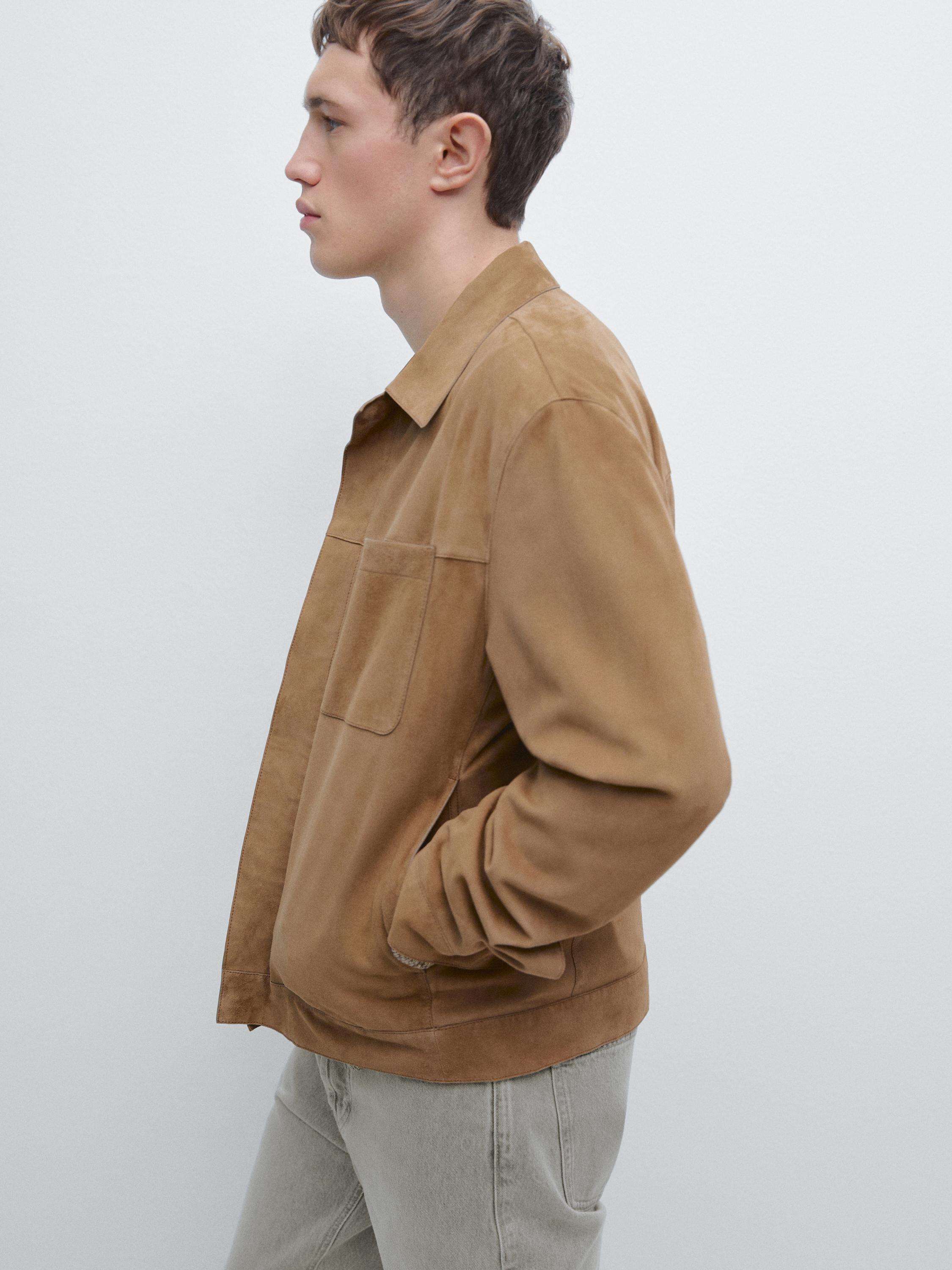 plaintext Medium shot of a mink jacket with front pockets and a classic collar.