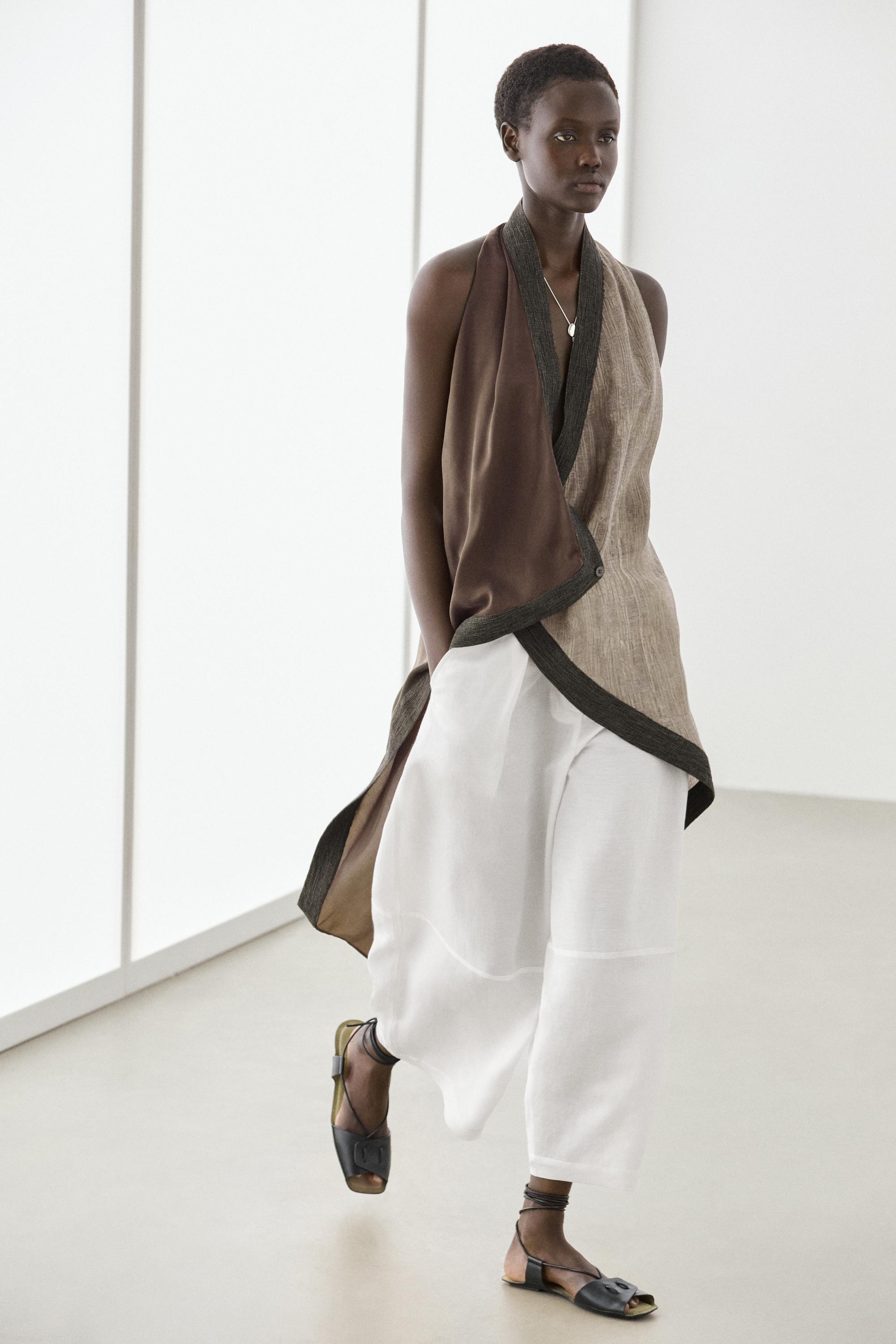 Flowing wrap top with mixed fabric detail